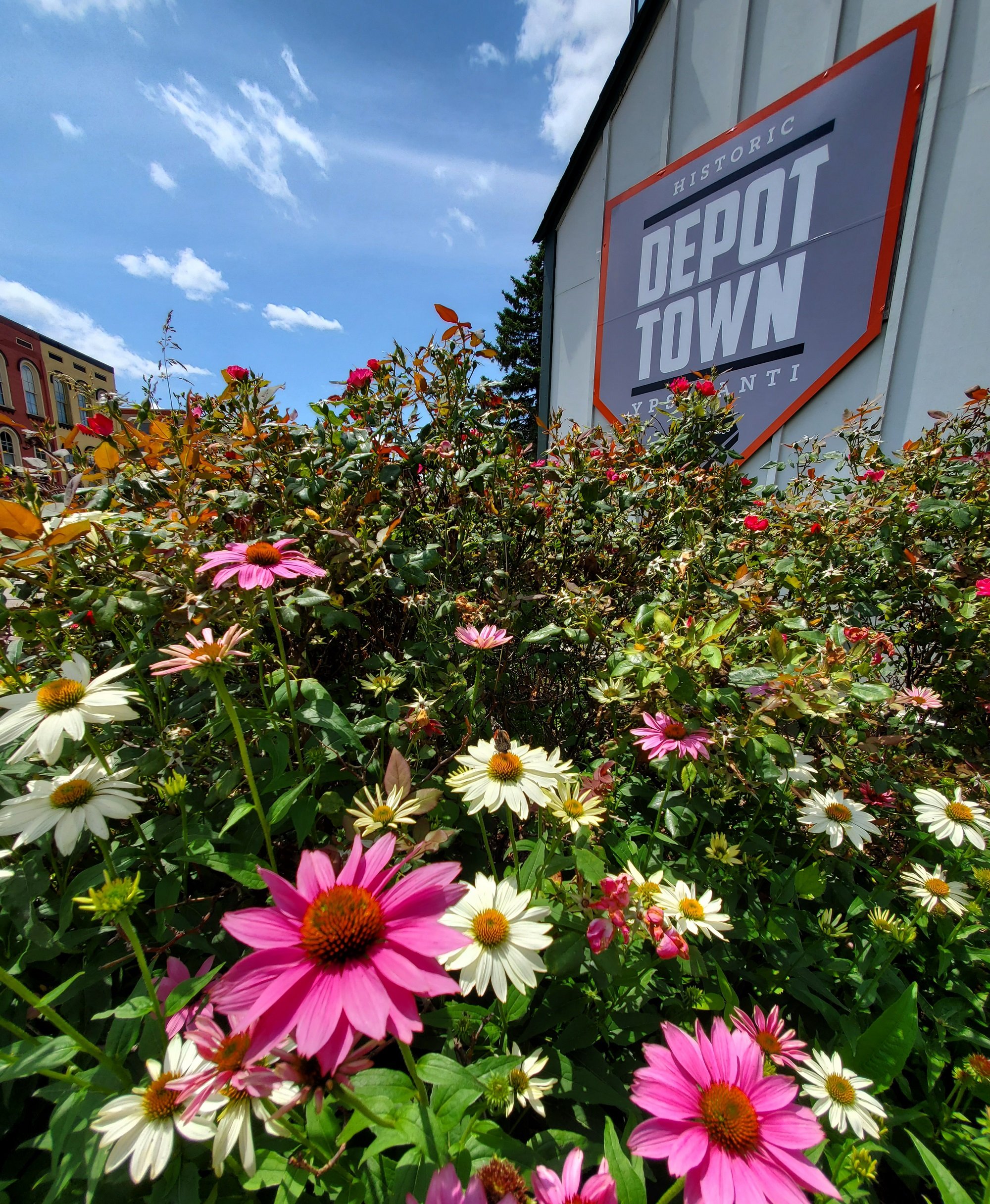 Depot town sign and flowers.jpg