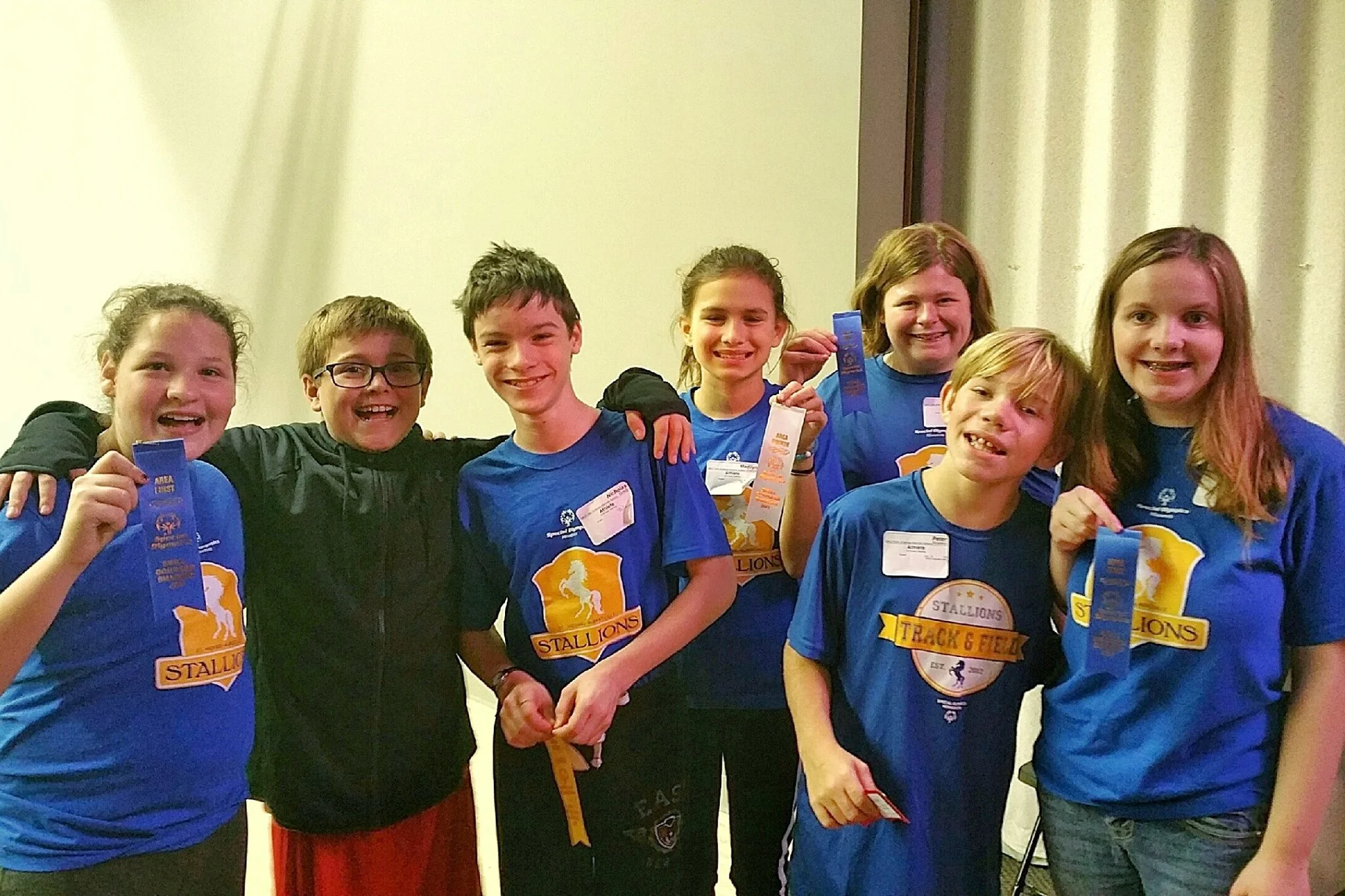 Carson pictured with several of his Special Olympics teammates and friends.