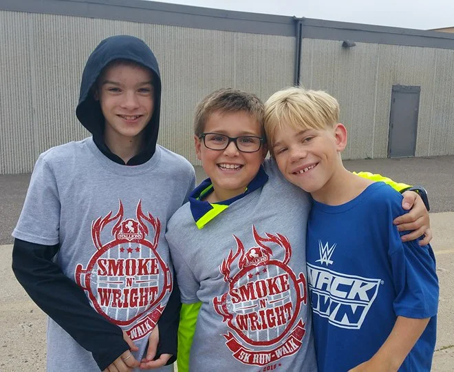 Carson pictured with two of his friends. Nick (left) and Carson (center) like to play Nerf Guns together. Peter (right) and Carson enjoyed basketball at recess.