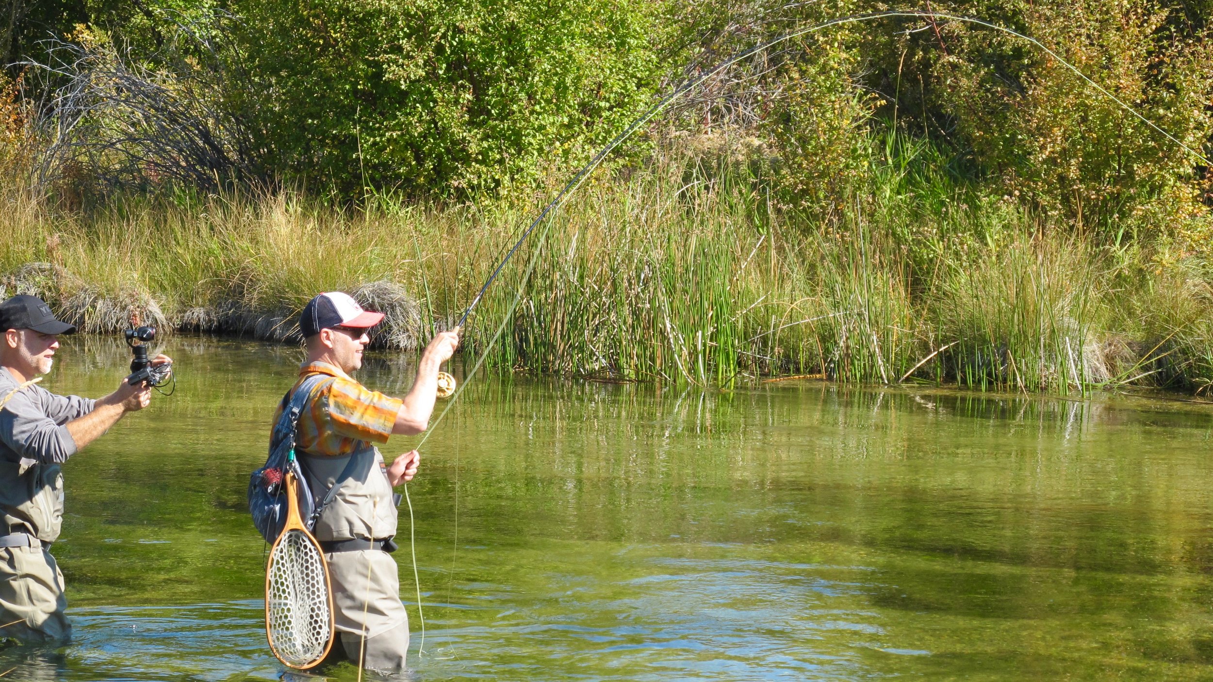 Travis playing a nice rainbow for the camera on Silver Creek.
