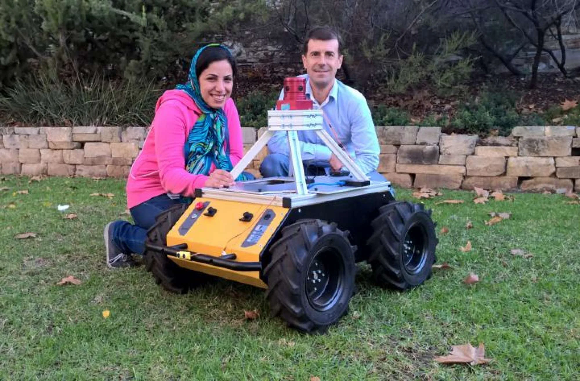 The University of Adelaide Scientists Zahra Bagheri and Benjamin Cazzolato, and robot.