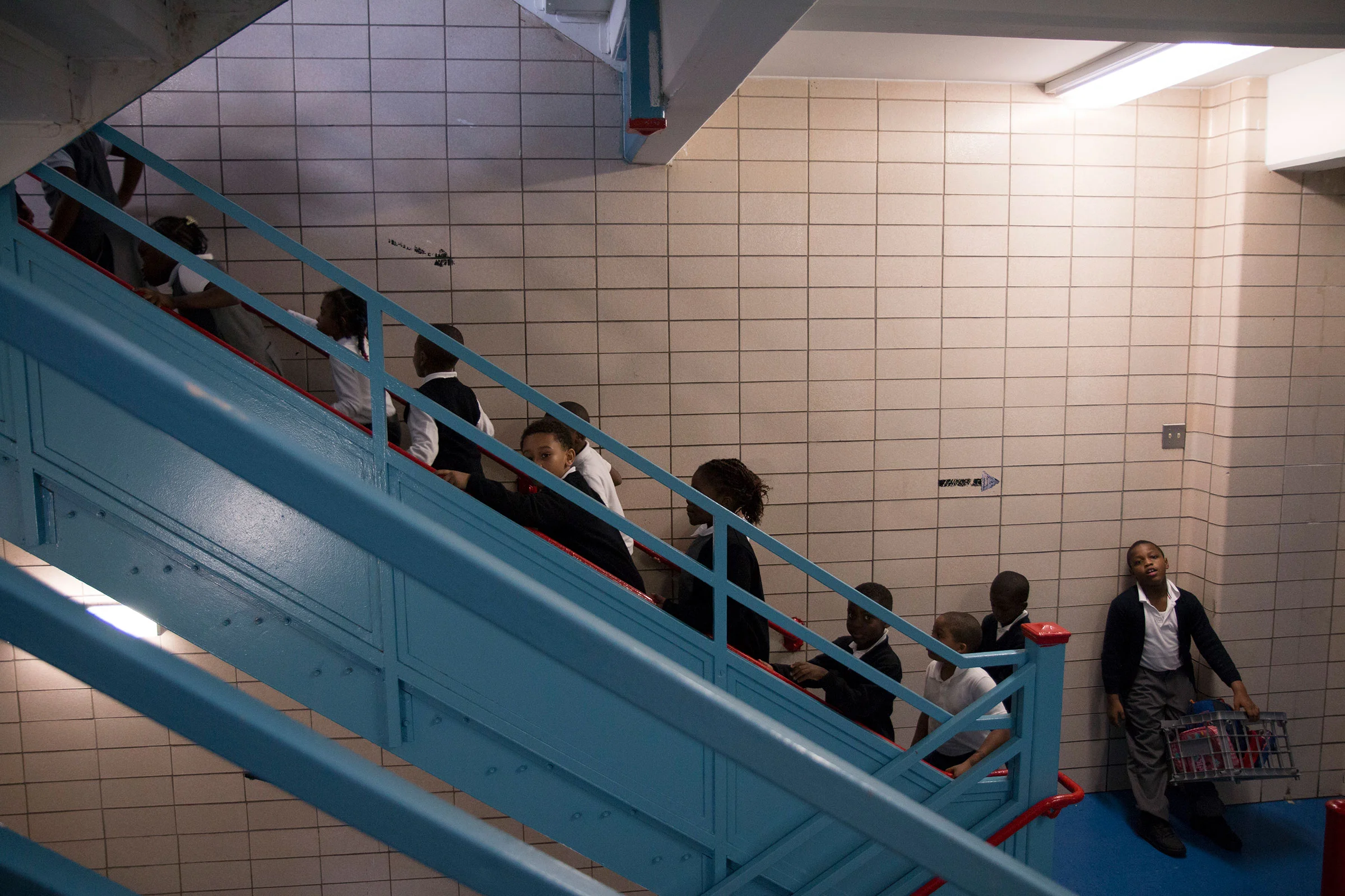 Second grade students walk back to class after lunch.