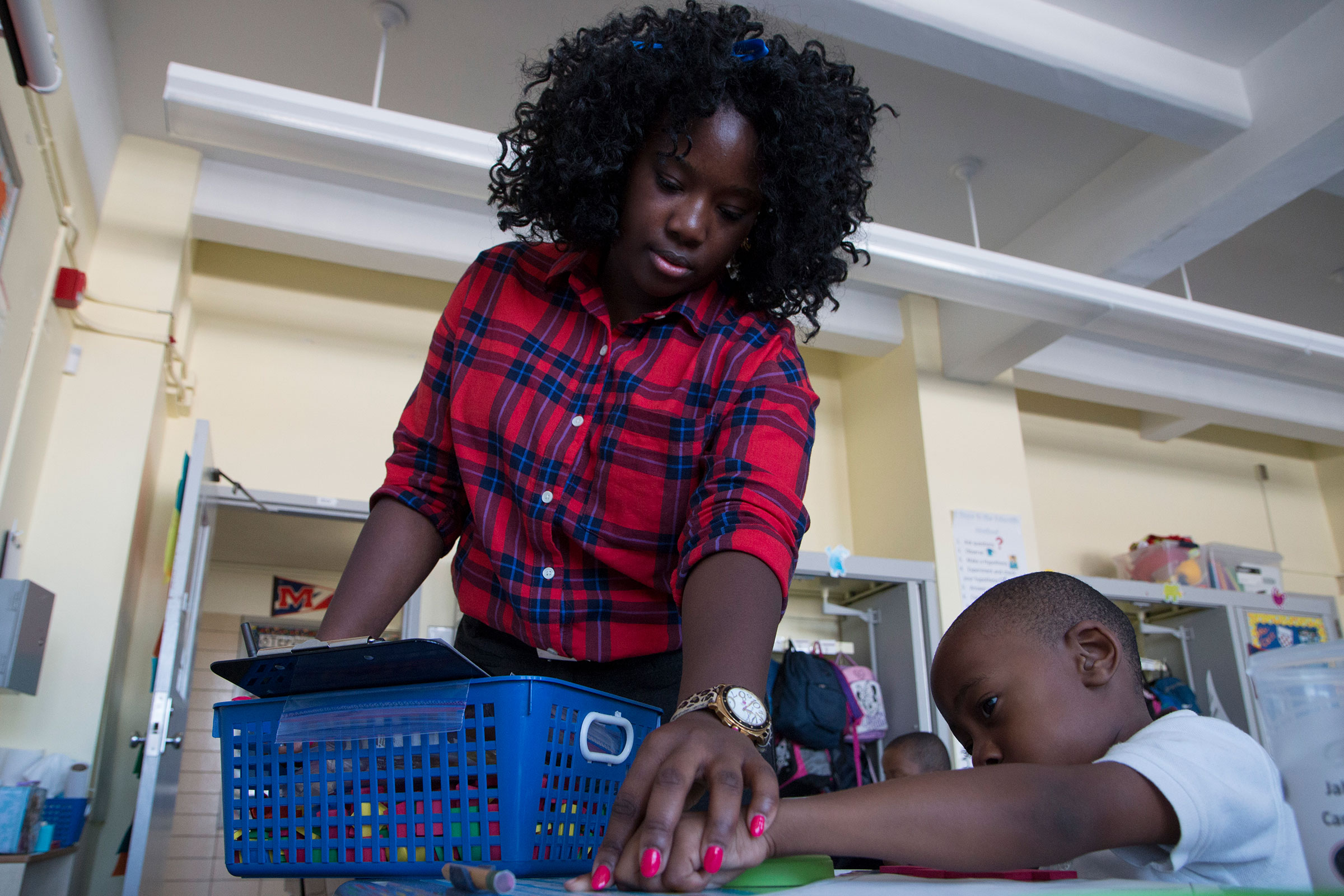  Kindergarten teacher, Stephanie Gamble, guides her student, Jahsim, through a counting exercise.  "We do a great job at really instilling good habits in our students, teaching them the value of hard work, having them experience struggle, and letting