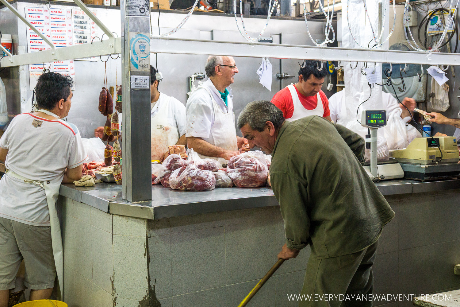 Taking a break after cutting all that meat in the Mercado de San Telmo.