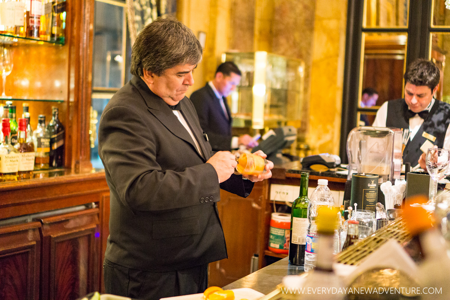 The manager, making my delicious old fashioned.