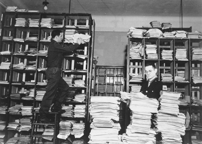 Stacks of German documents collected by war crimes investigators as evidence. US Holocaust Memorial Museum, courtesy of National Archives and Records Administration, College Park, MD