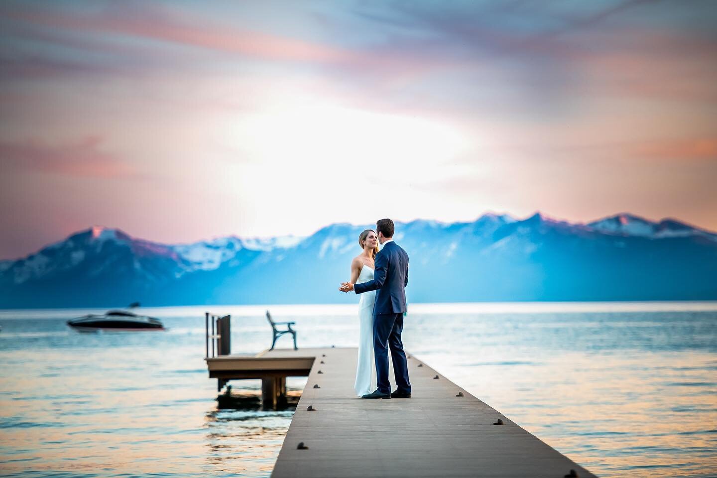 A + Z share a blissful moment on a private pier in one of the most beautiful places on earth. #laketahoewedding #kenvialephotography