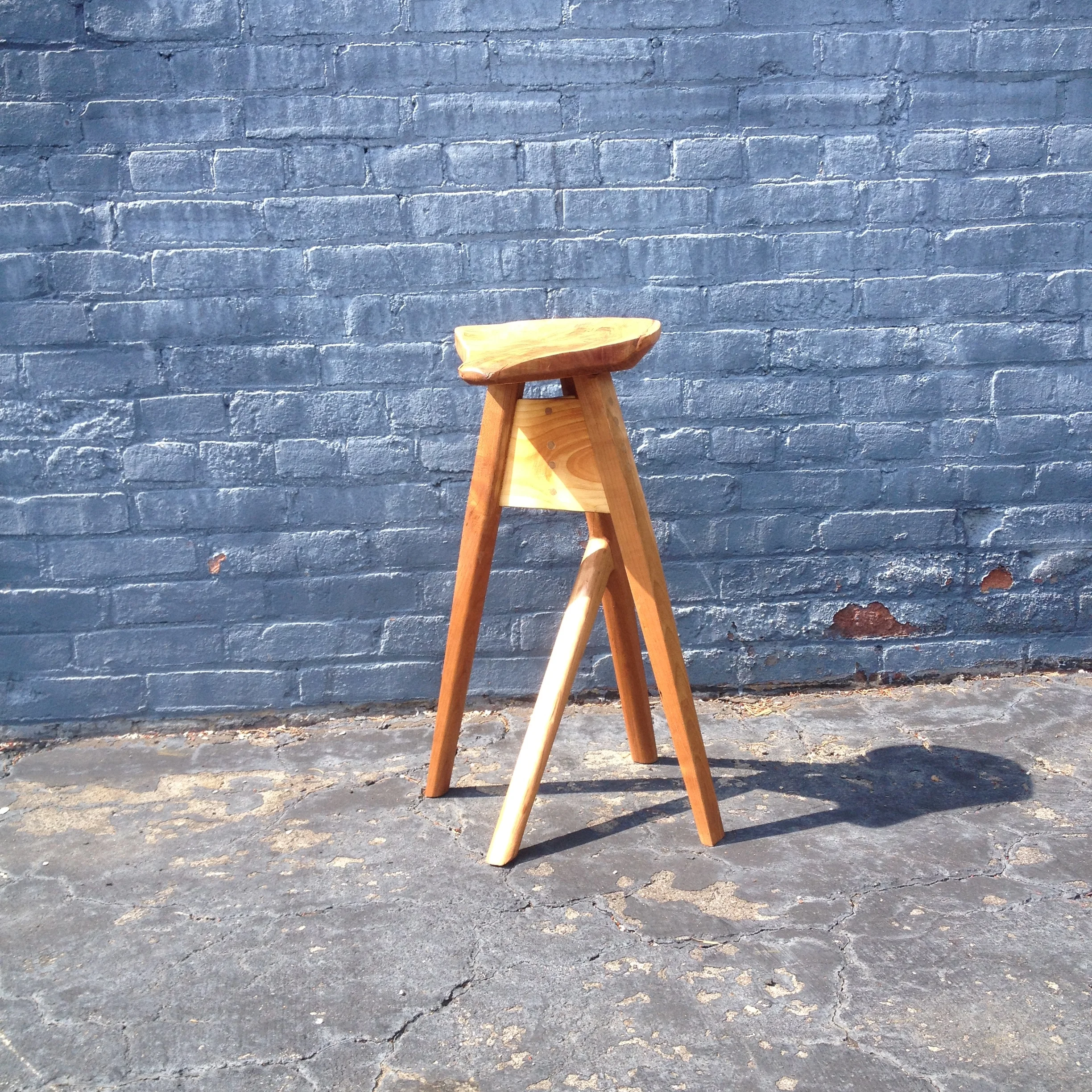 A weird stool I made just for shits. It's basically designed around my lack of wood at the time. The seat is a weird crotchy part of a log a friend gave me. I would like one day to make it again but... you know... better.