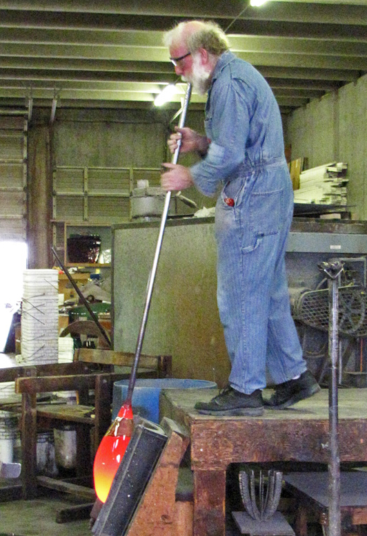 Jim Flanagan of Fremont Antique Glass blowing antique glass.