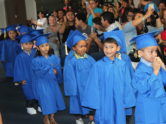 Our parents could barely contain their excitement as the KidWorks Preschool Class of 2016 entered the auditorium. 