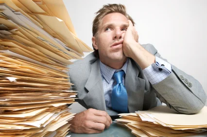 Back-office-stack-of-paperwork.jpg