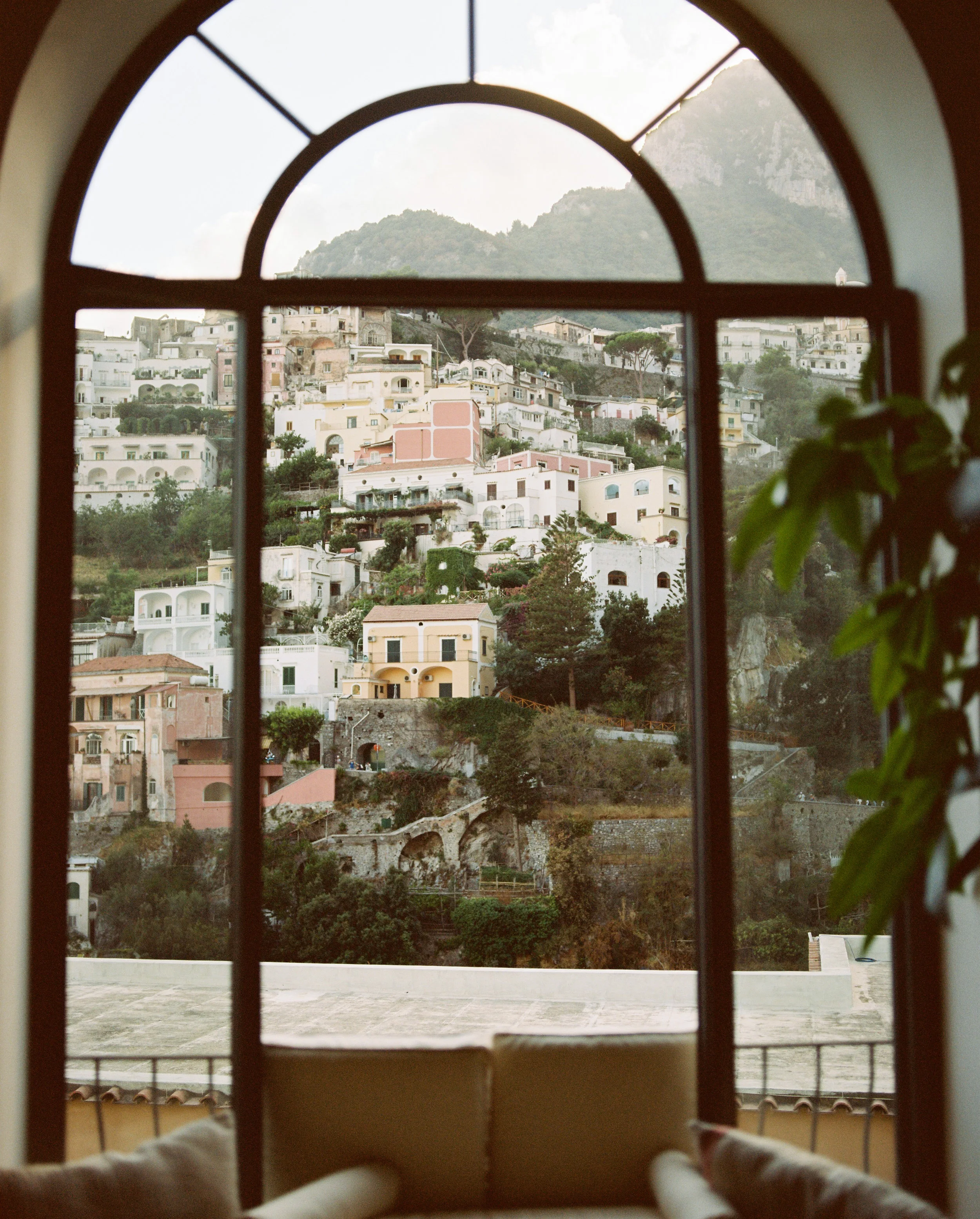 Typical amalfi coast view through a window, by Vancouver-based photographer Andrea Fernandez