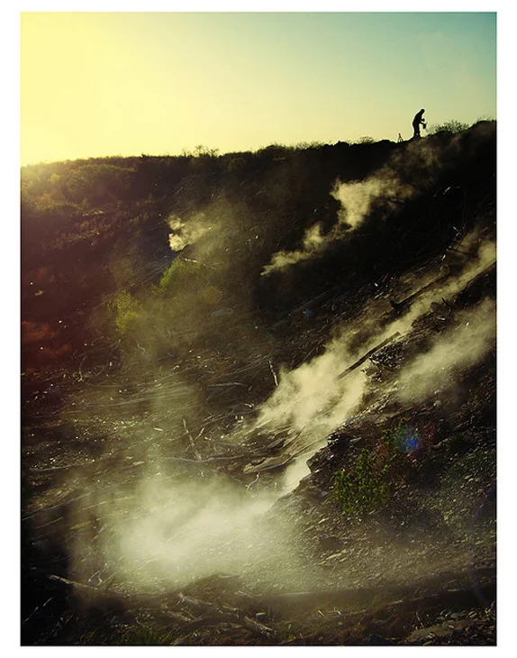 theparisreview :
“Centralia, Pennsylvania, is a town that barely exists. It is a blip of a place, almost indistinguishable from the endless forest flanking state road 61 in the rambling northeast quarter of the state. There are no hulking ruins—not even a sign that alerts you when the town begins or ends. Though the population of Centralia peaked in the 1960s at more than two thousand people, now fewer than ten live here. After the nineties, road maps and atlases began leaving it off their indexes; the post office revoked its zip code in 2002. The reason is simple: Centralia has been on fire for almost fifty years.”
American Inferno . Photograph by Eric Hart.
It is possible to burn for always?