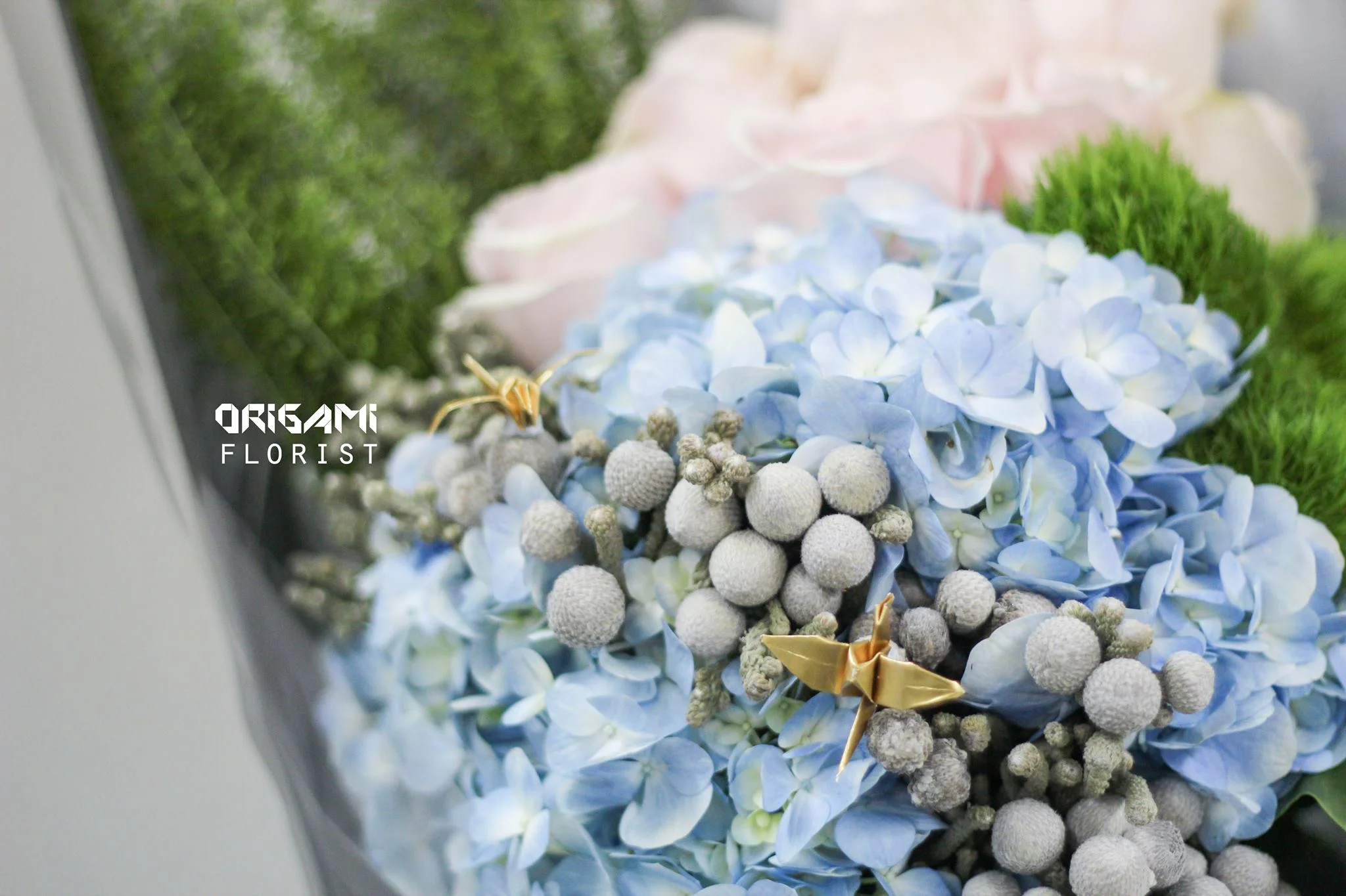 A "pebble path" that cuts through the pale blue hydrangea which symbolizes a lake.
