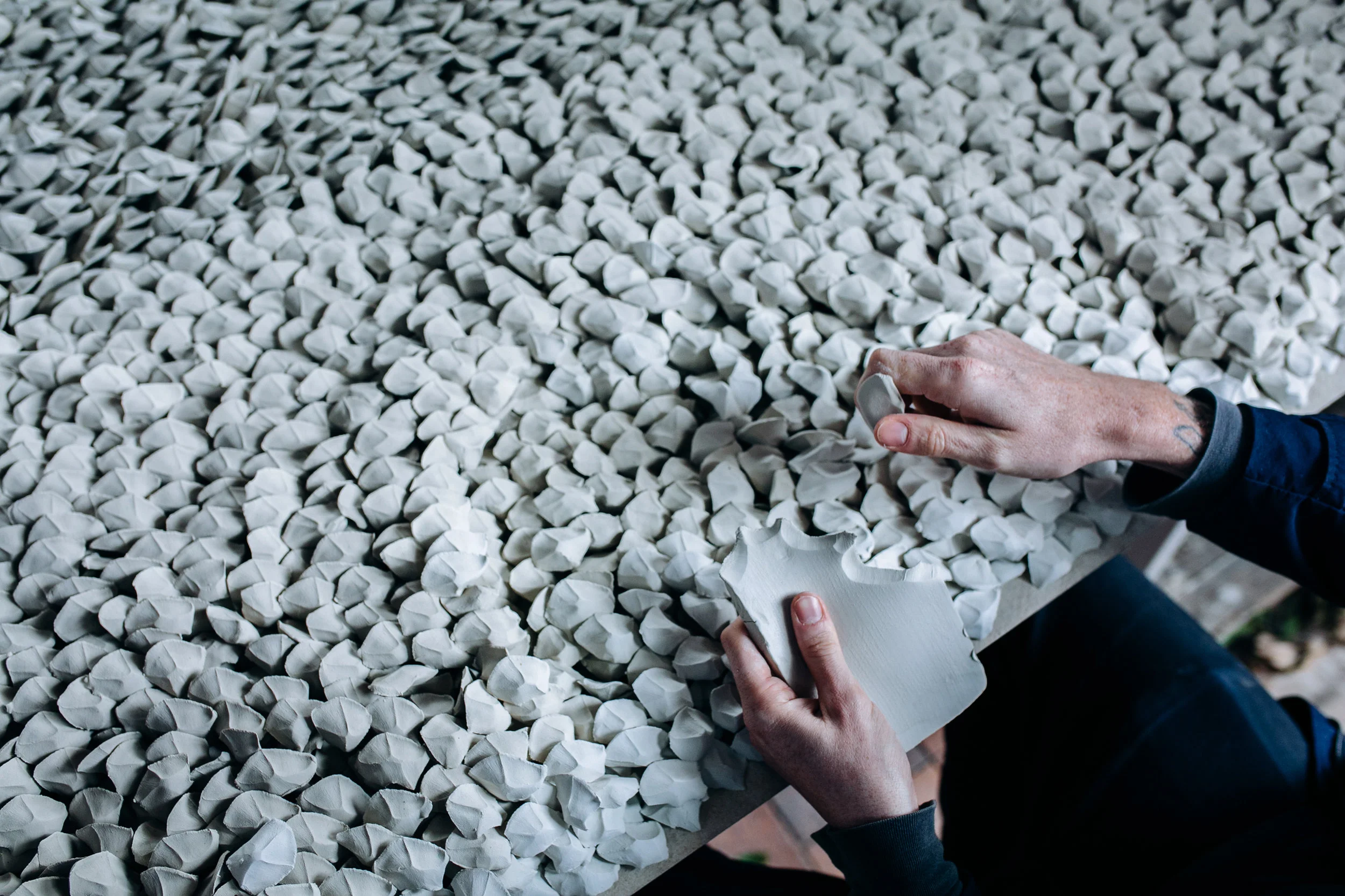 Top and bottom: The pinching process behind creating the ceramic 'stones' (photographs: Hannah Roche).
