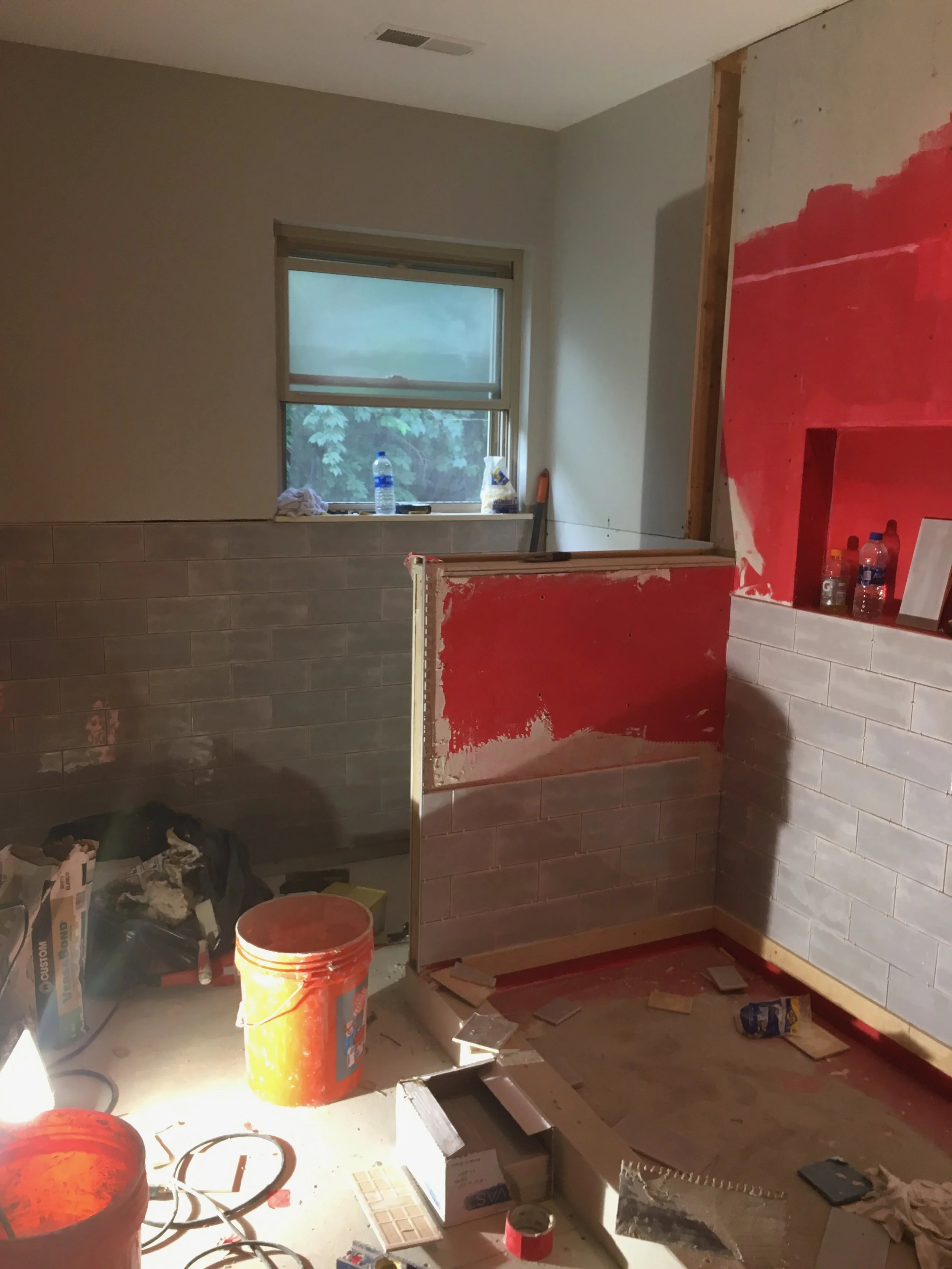 Tile starting to go in, and the space starts to turn the corner.