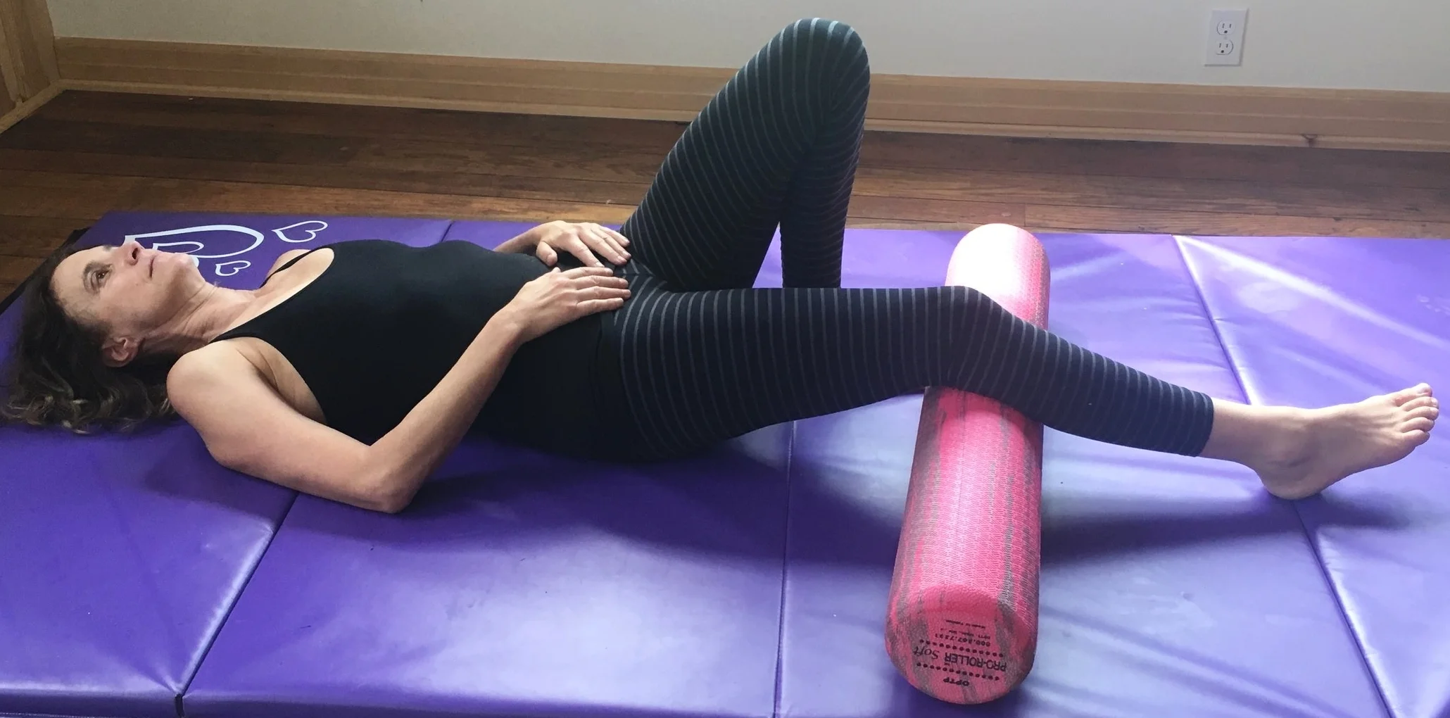 Step 3: End Range Knee Extension 1: Lie on your back with your knee over the roller, allowing the knee to be bent, heel on the floor.