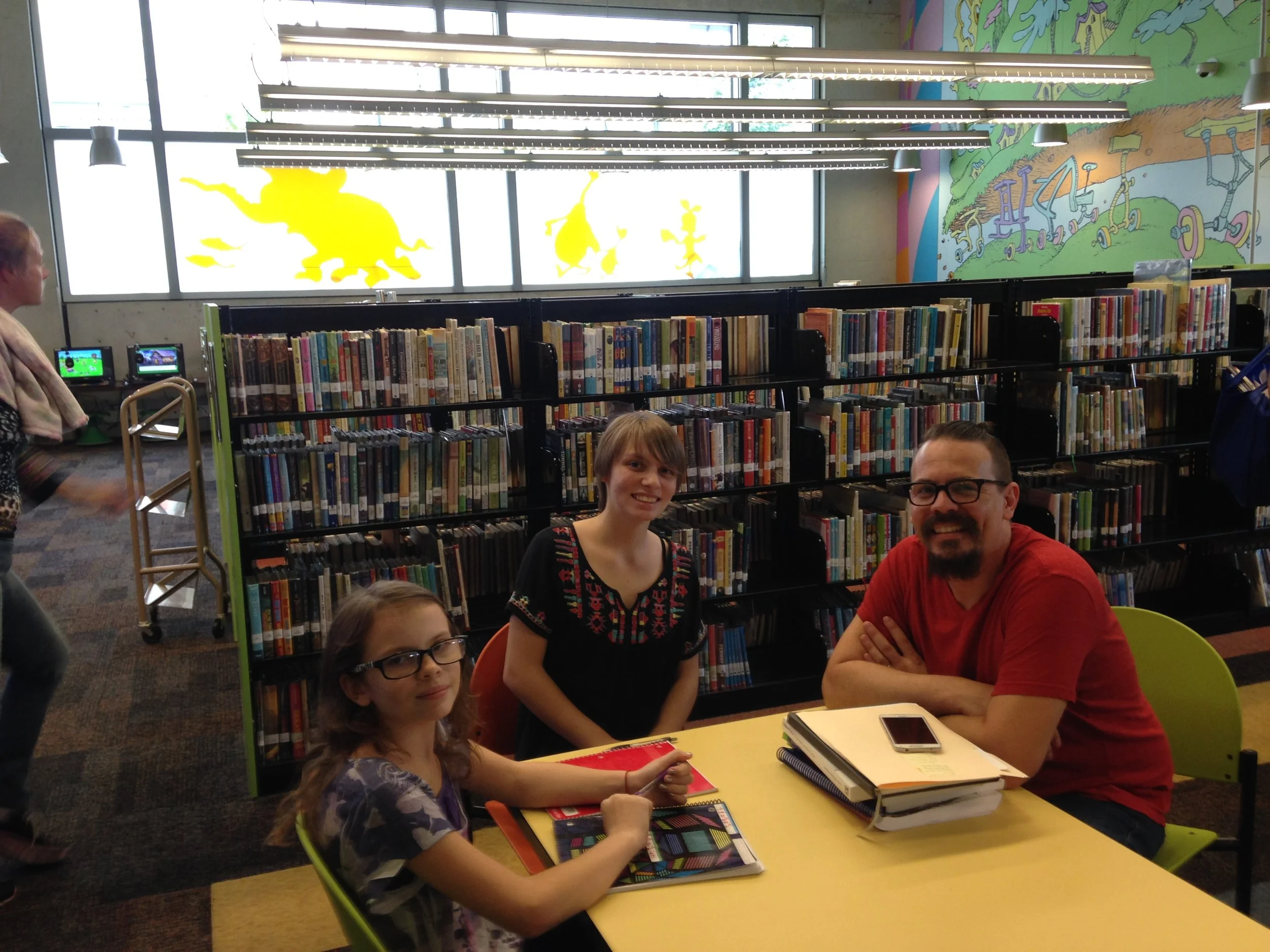 Isabel, Fabienne, and Ethan Sparks touring the Central Branch of the San Diego Public Library