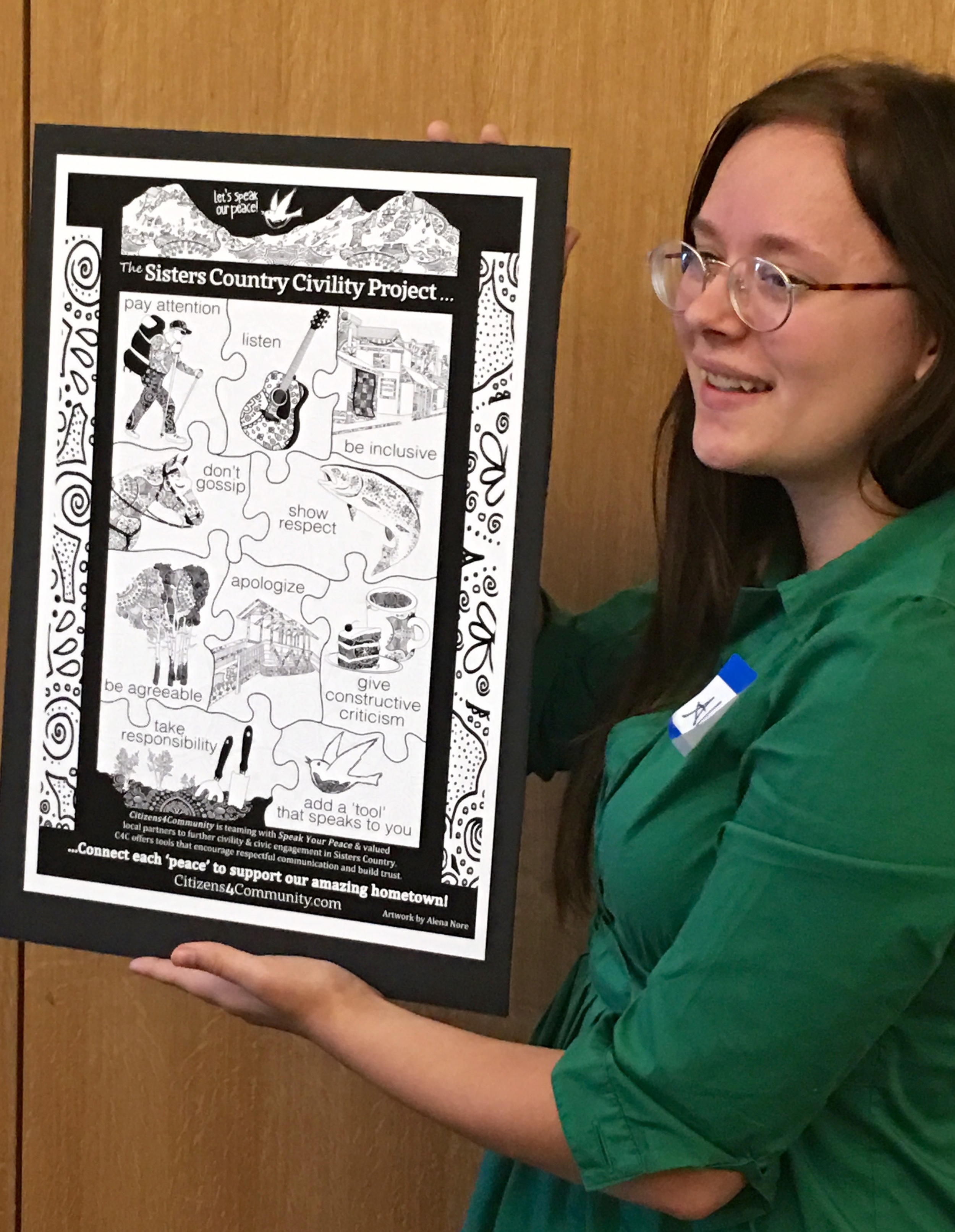Alena Nore presents her Sisters Country Civility Project poster artwork on July 12 at the Sisters Fire Hall during C4C's quarterly information and learning session.