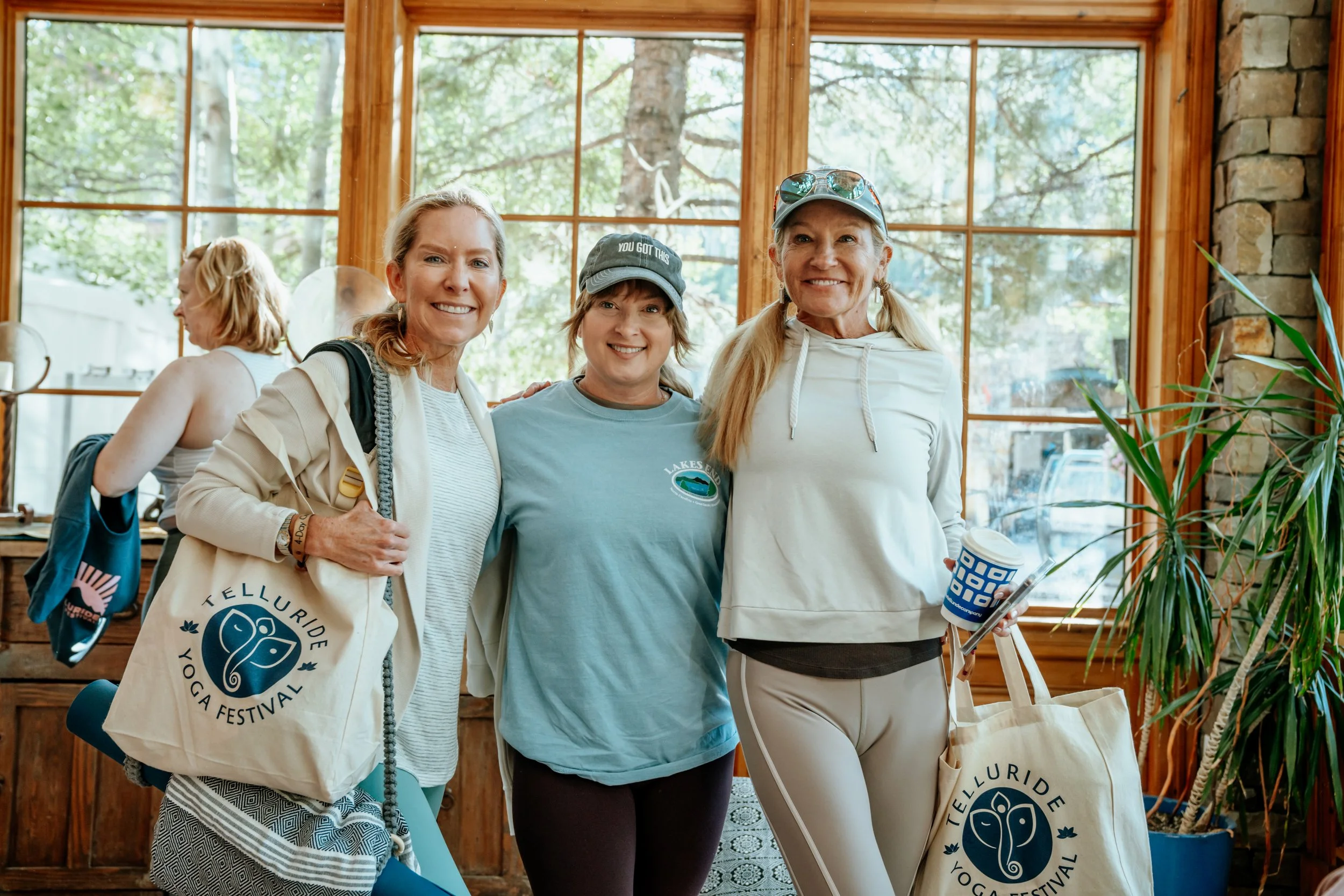 PalmaCaruso_Attendees posed smiling at Registration.jpg