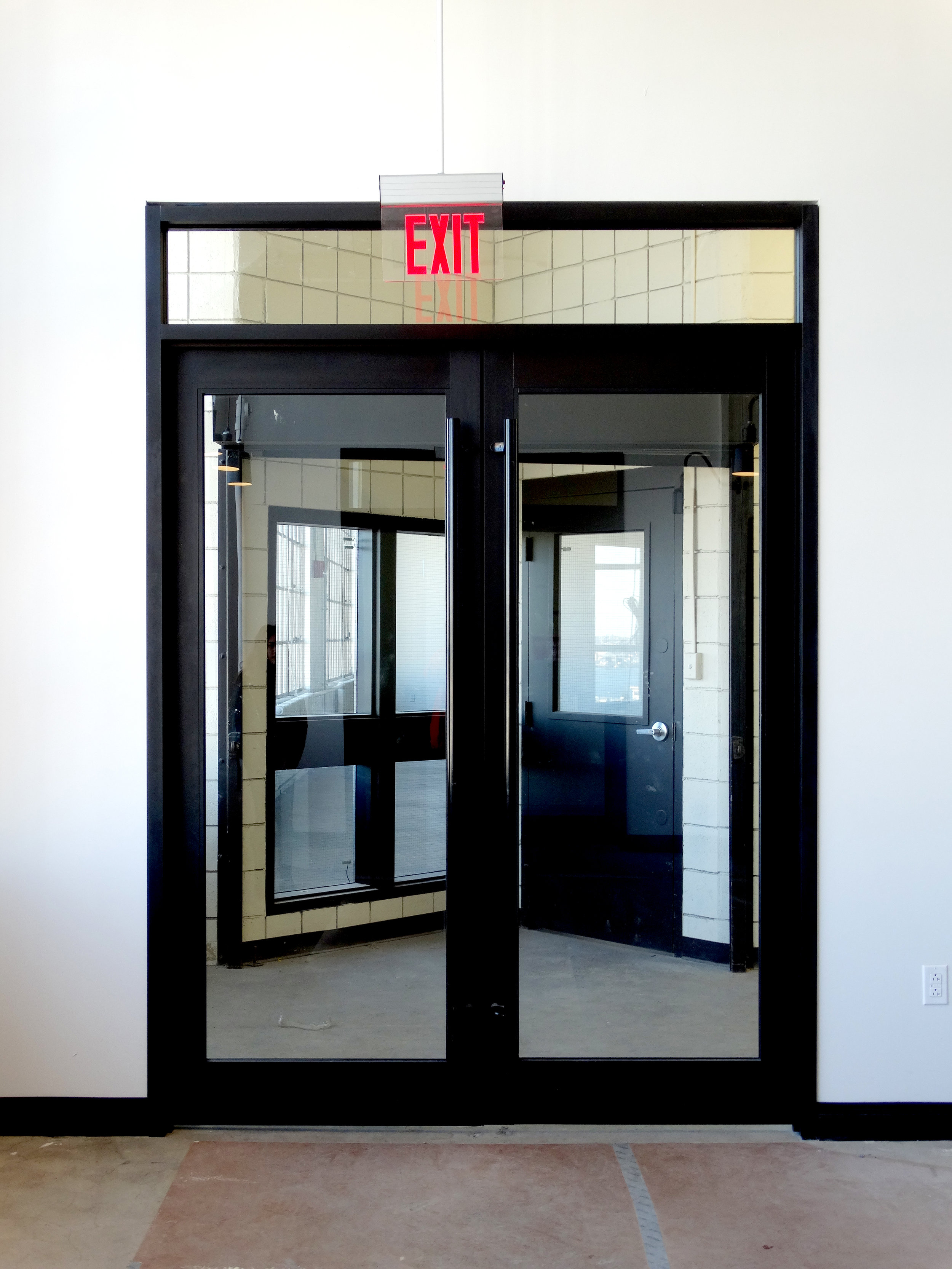Encase Black Aluminum Elevator Lobby Doors - Spaceworks AI.jpg