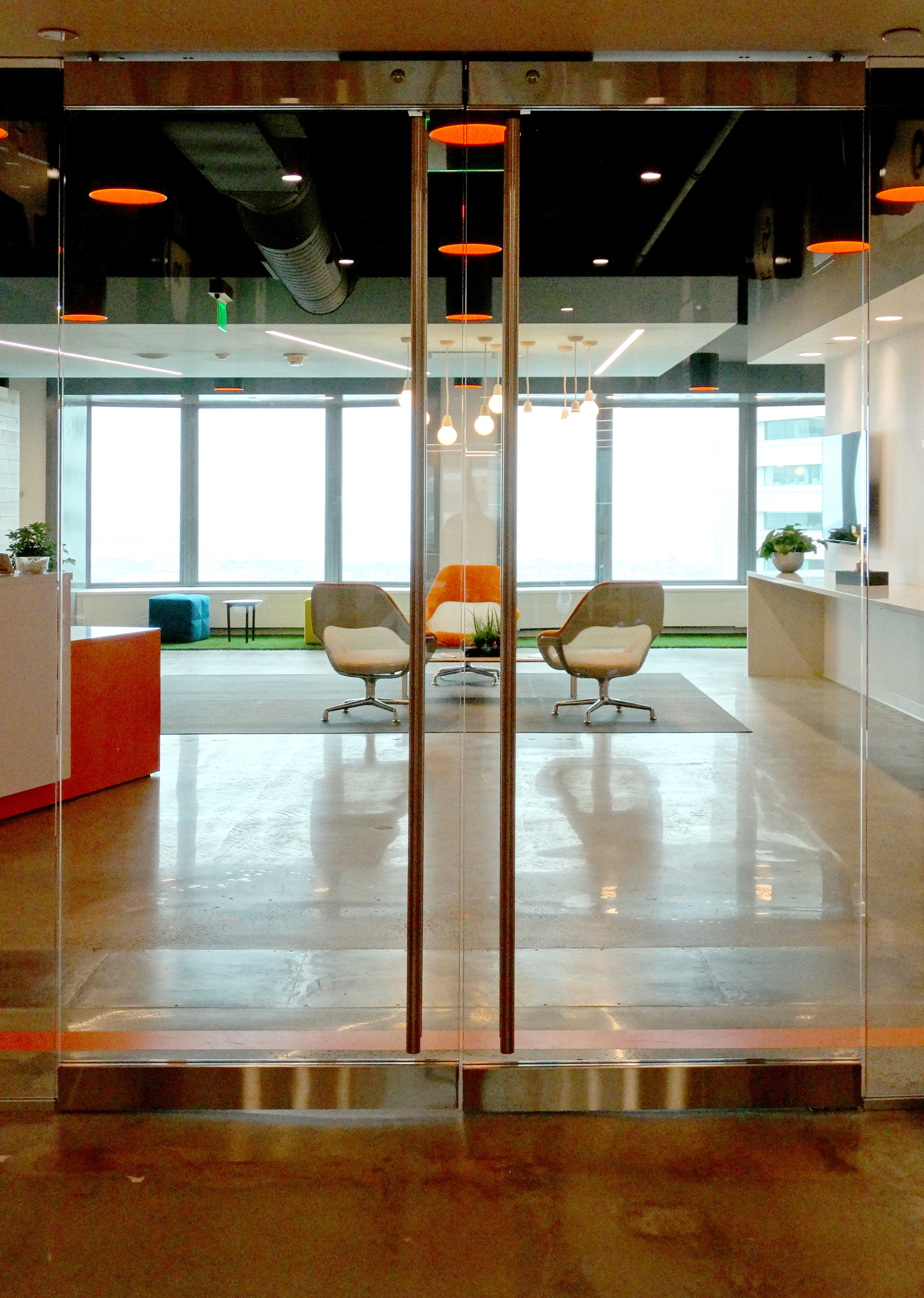 Illume Elevator Lobby Frameless Doors - Spaceworks AI.jpg