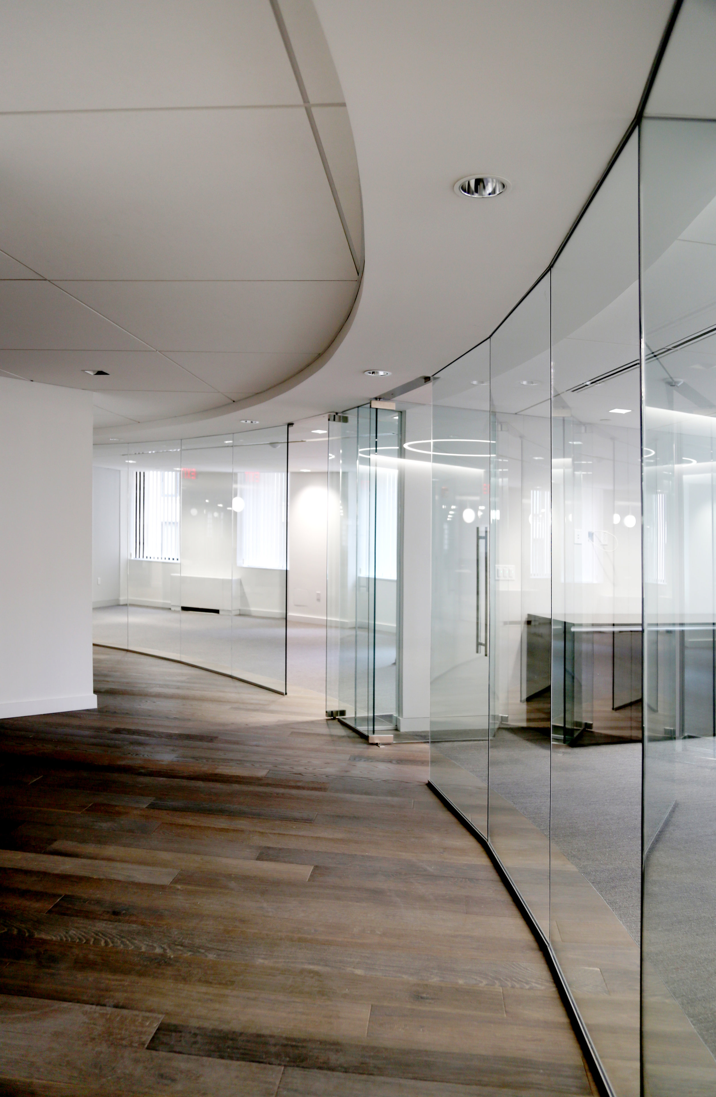 Illume Frameless Glass Curved Wall - Spaceworks AI.jpg