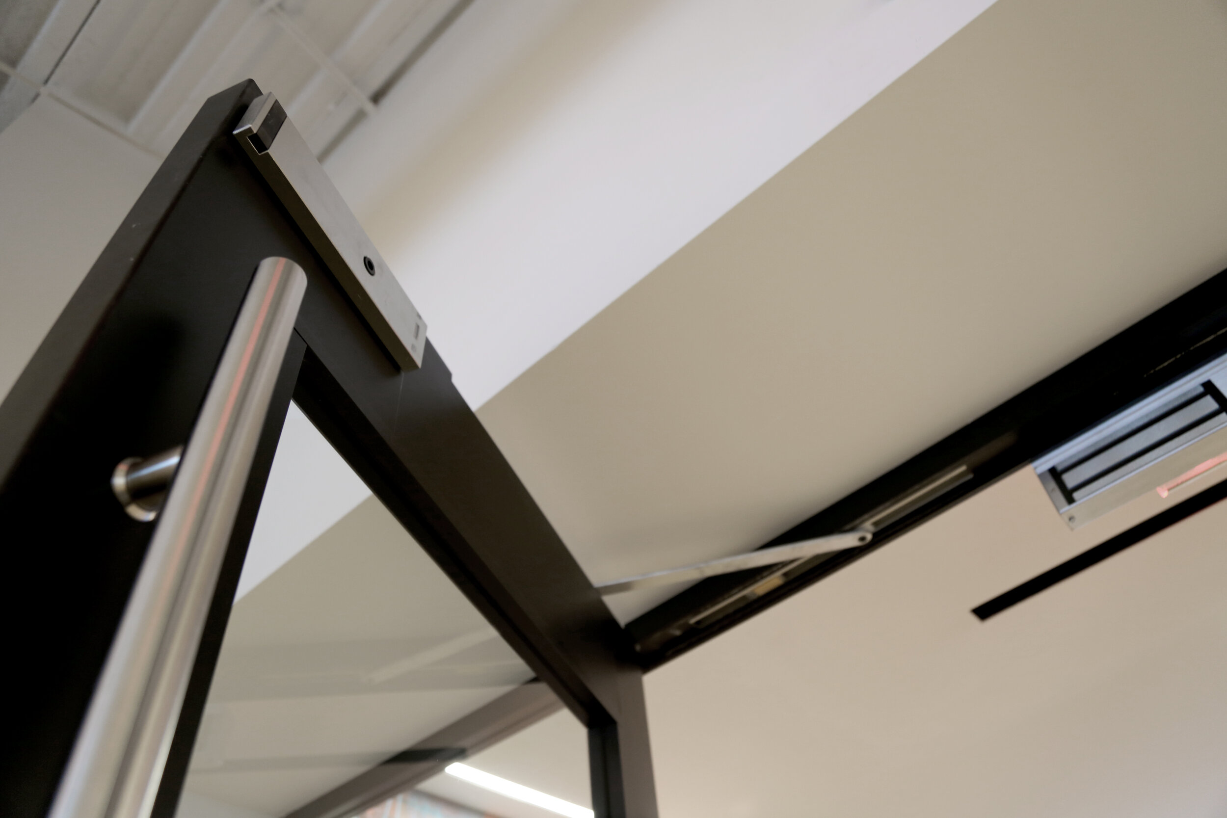 Black Anodized Aluminum-Framed Elevator Lobby Entry Doors with Maglock - Spaceworks AI.jpg