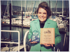 12196272-dr-sylvia-earle-accepts-care2-impact-award-named-2013-wigf-trailblazer.png