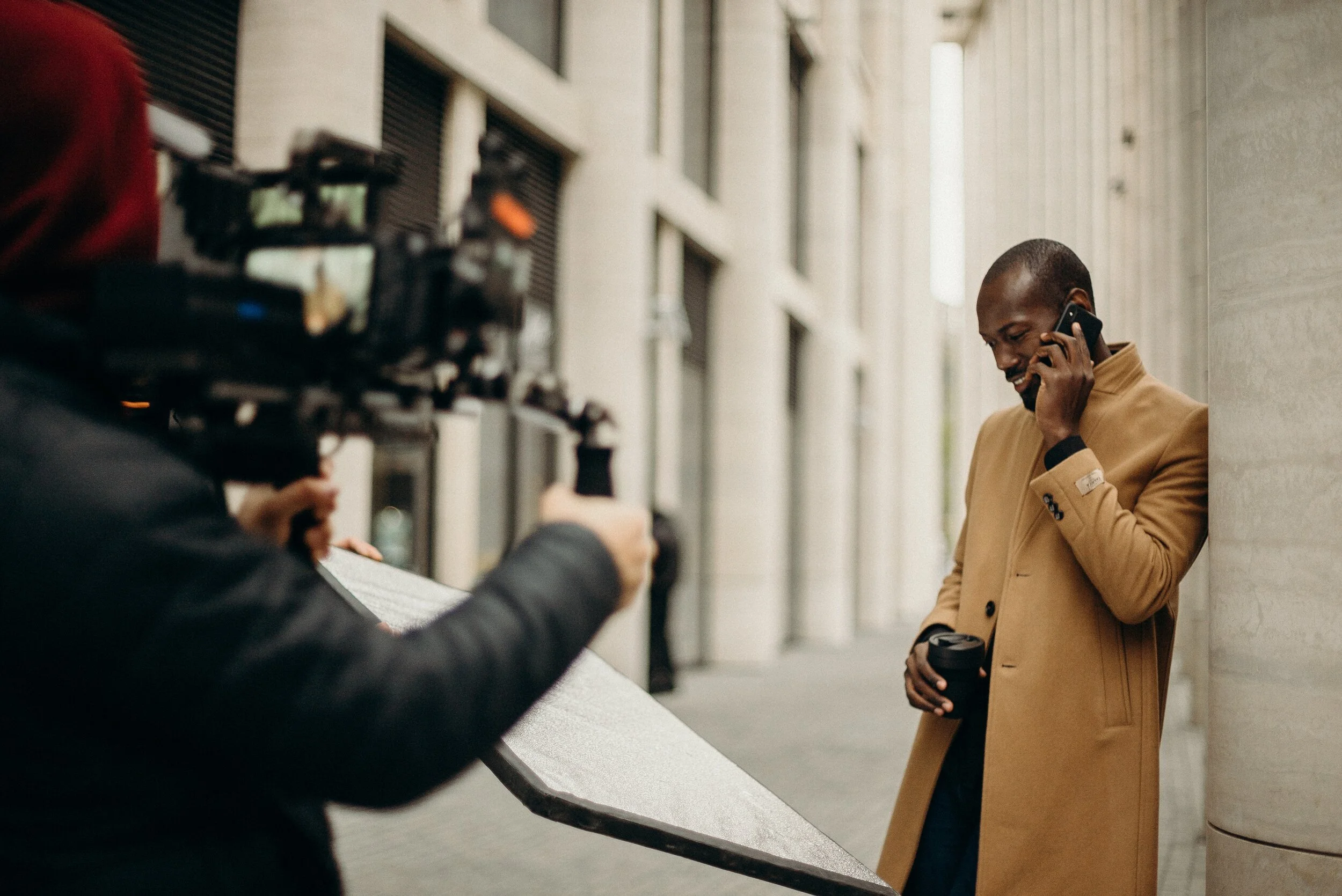 man-wearing-yellow-coat-using-smartphone-3206121.jpg