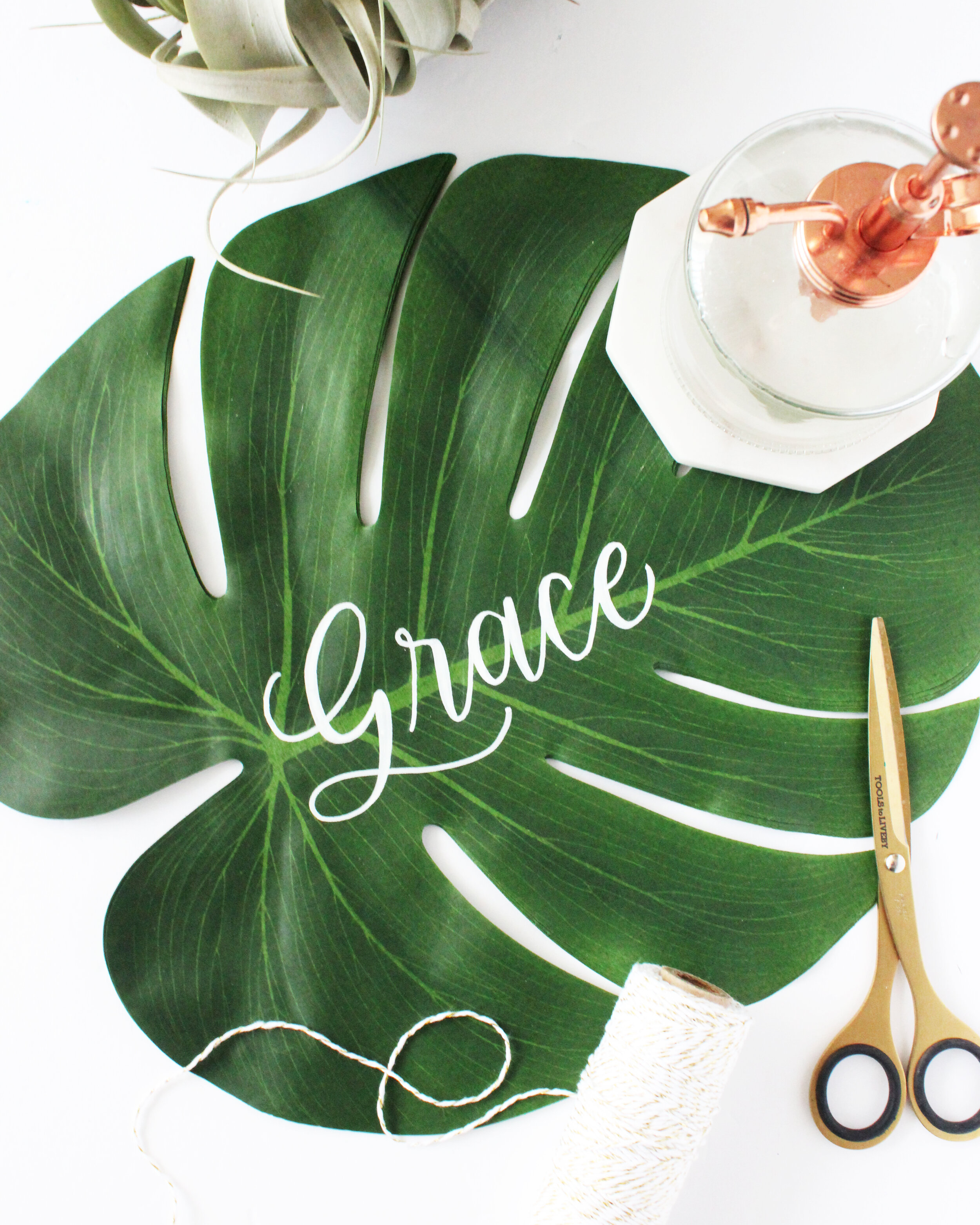 Personalized monstera leaves as placemats