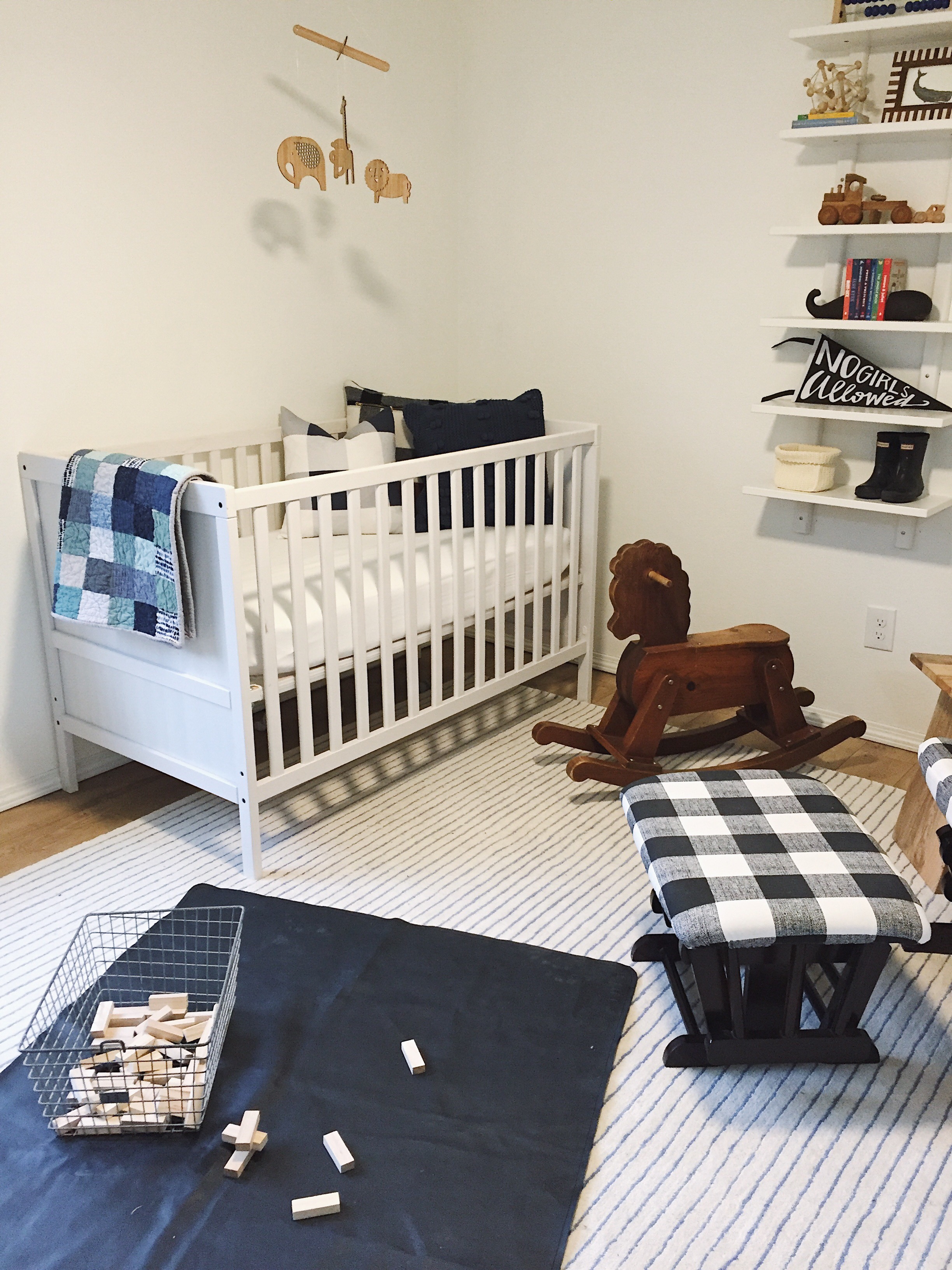Gathre Mat , Rug (similar) , Crib (similar) , Light and Dwell Pillow, Rocking Horse (similar) , Locker Bin , Shelf (similar)