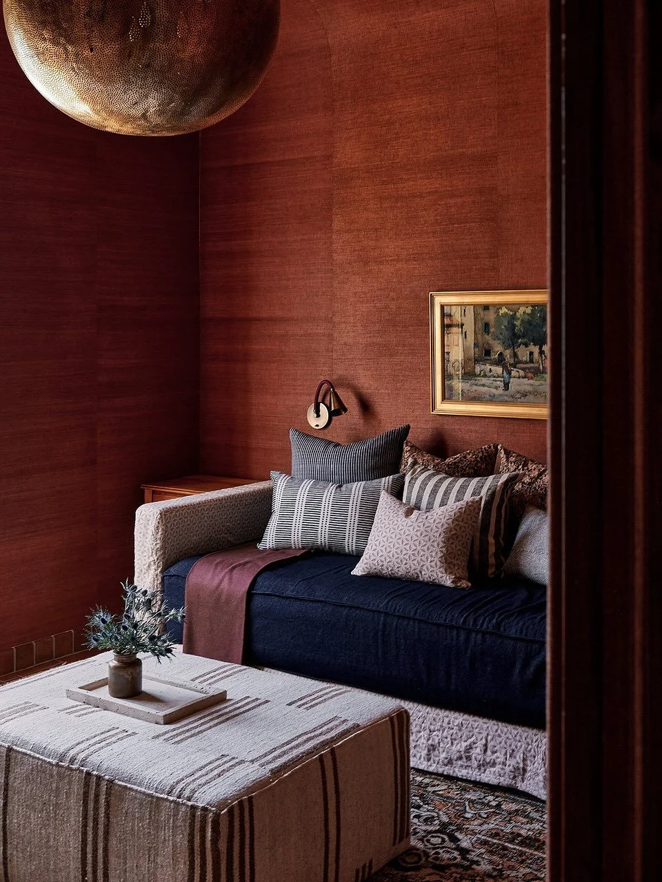 The &ldquo;play room&rdquo; of our California Villa.
Wrapped in rich terracotta grasscloth with vintage rugs, collected art, custom furniture, and a paint by number matador honoring our clients&rsquo; heritage.
The best spaces feel organic, layered, 