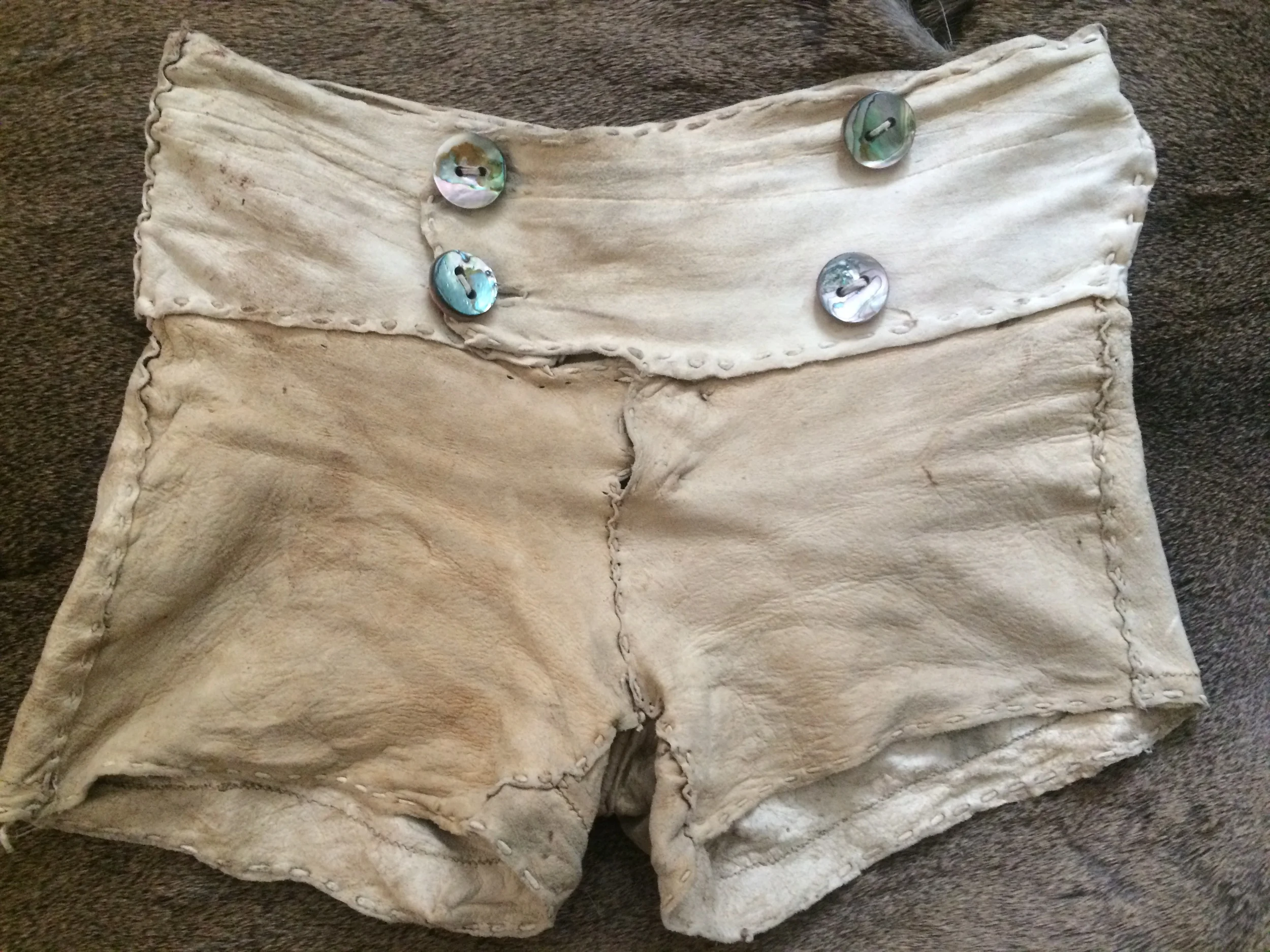 brain tan deer skin, abalone buttons