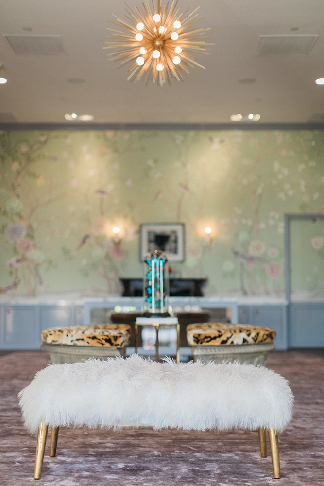 The details within the space are intended as “wow” pieces, geared to encourage customers to pause for pictures and social media shares. It is decorated with a tiger print ottoman, shagreen and chinoiserie-printed wallpaper as well as mauve carpeting. A favorite piece is the sputnik Artemisia chandelier which adds elegance and charm that sets the tone for the entire space.