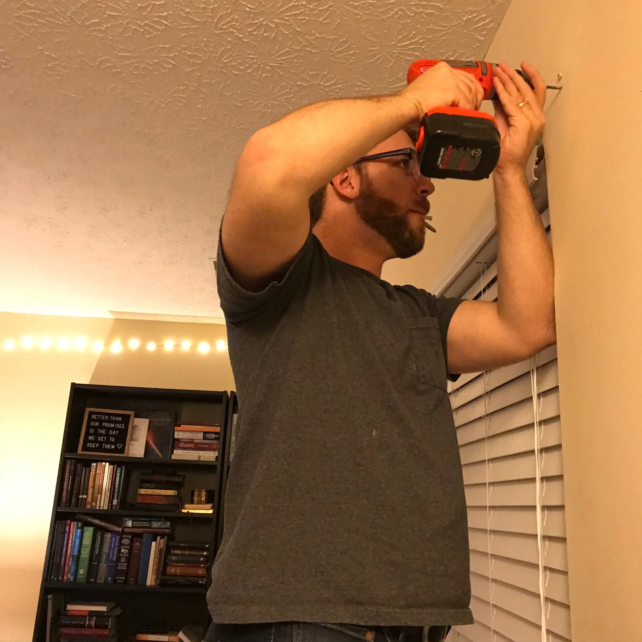 Andrew being a dreamboat and hanging my curtains on Sunday.
