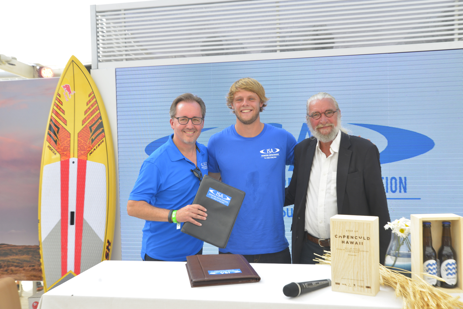 Finn Jorsal (left), president of Friends of Cold Hawaii, and Robert Fasulo (right), executive director, ISA, and Casper Steinfath (middle), ISA and Cold Hawaii, in the Danish National House in Rio, after signing the COPENCOLD HAWAII – ISA World StandUp Paddle and Paddleboard Championship 2017 hosting agreement.