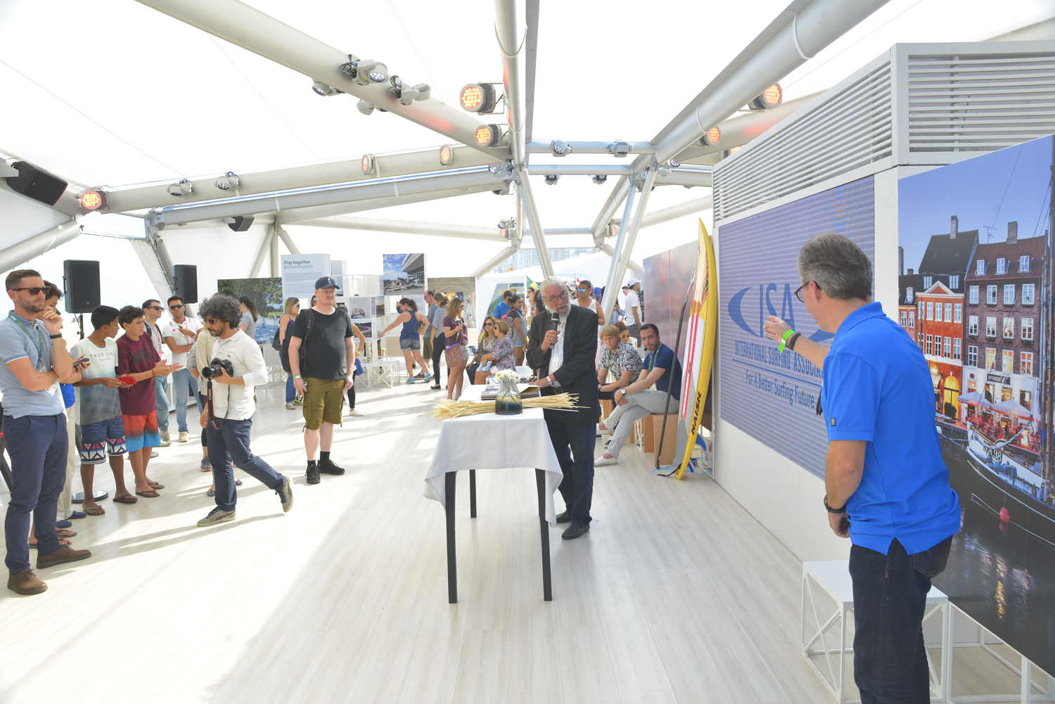 Finn Jorsal (left), president of Friends of Cold Hawaii, speaking in the Danish National House in Rio before the signing of the COPENCOLD HAWAII – ISA World StandUp Paddle and Paddleboard Championship 2017 hosting agreement. To the right: Robert Fasulo, executive director, ISA.