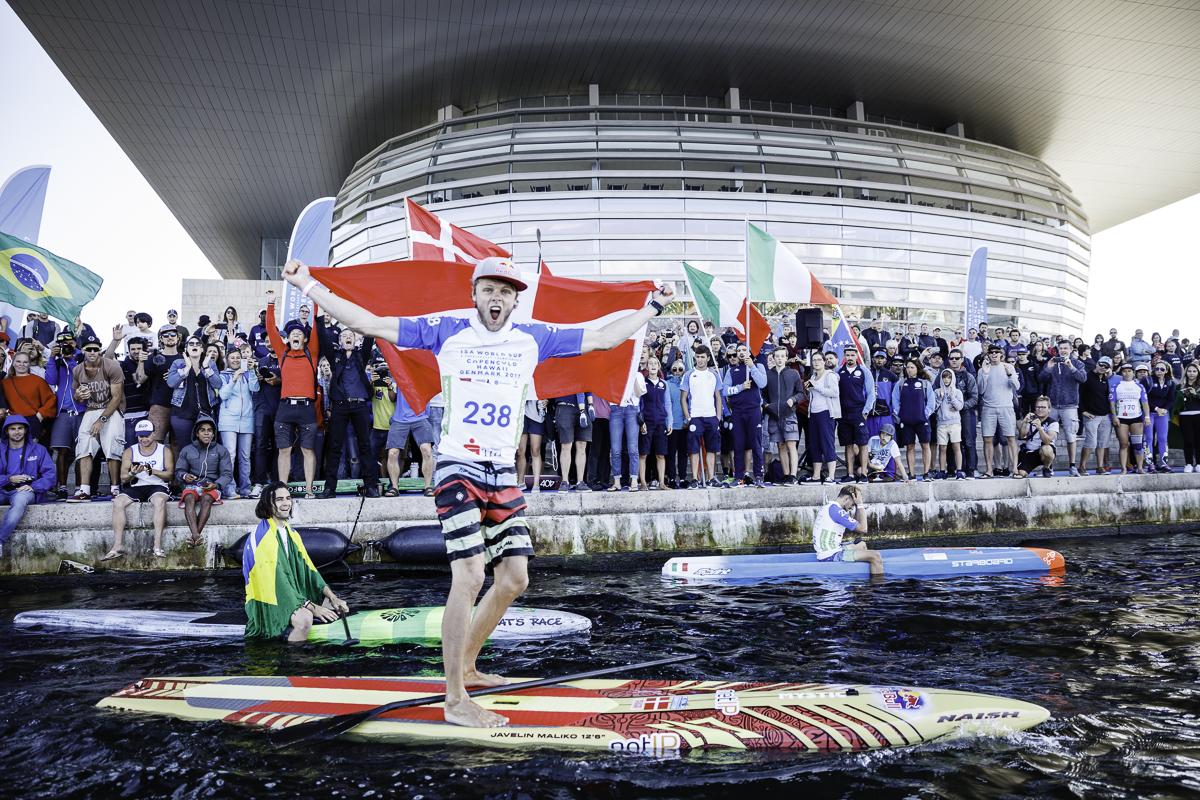 Local sensation, Casper Steinfath overcame a second-place finish in the semi-final to deliver a commanding gold-medal performance in the 200-meter SUP Sprint Race Final. Photo: ISA / Ben Reed. 