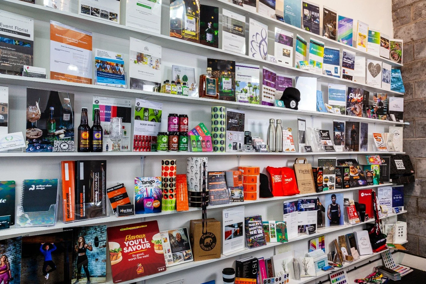 This wall tells a story.

Every project on it started somewhere else: a conversation, a sketch, a problem to solve, an idea that needed brought to life.

Branding. Websites. Photography. Print. Signage. Garments. Marketing. Years of work, all in one 