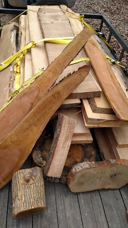 The first load of southern hardwoods! Harvested by a Mississippi arborist, these slabs have air dried in a warehouse for several years and are reading 14% moisture content. Next step is to kiln dry them to between 7-12%. Finished furniture is coming soon!