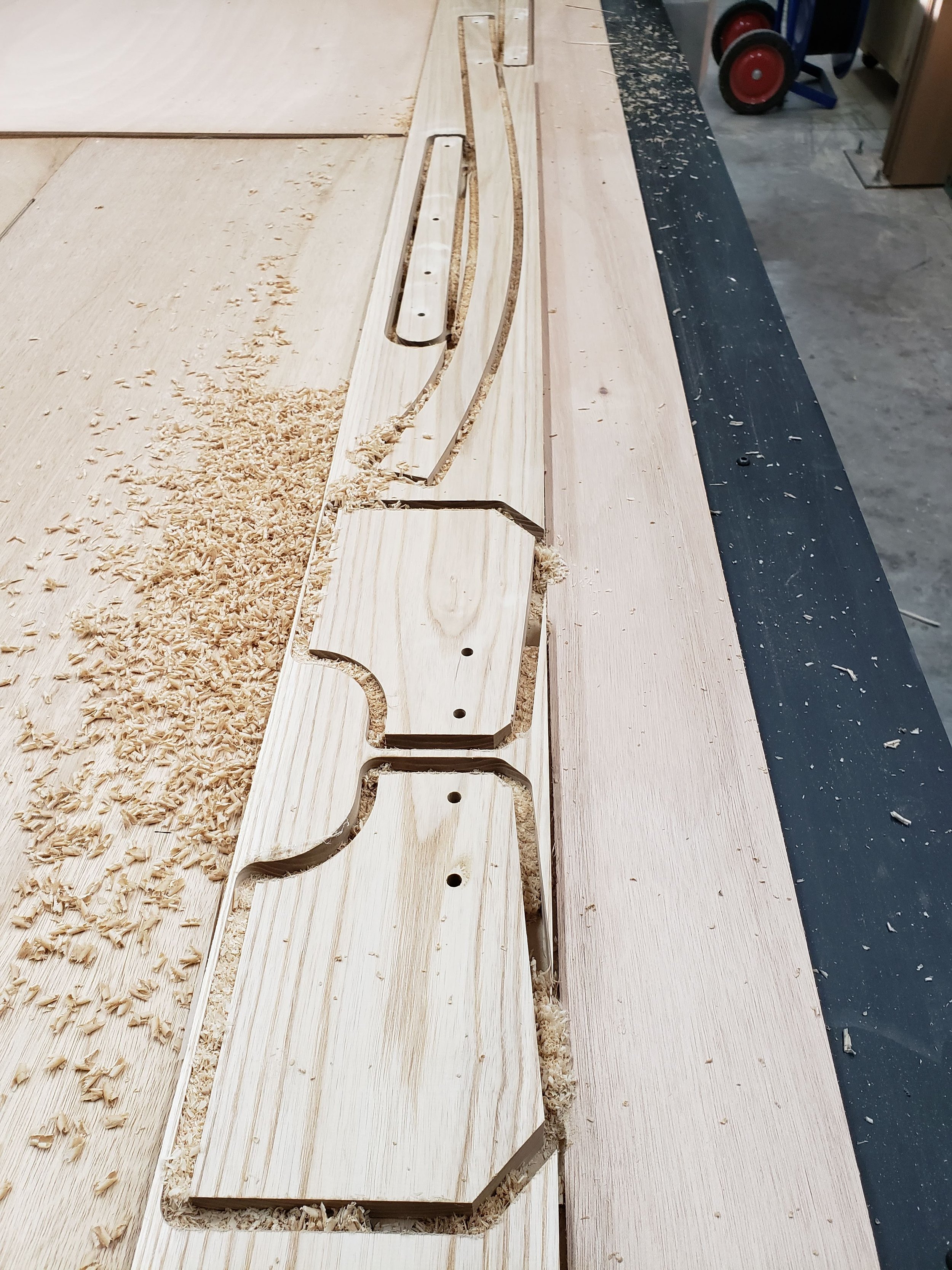 Many of the hardwood components that require bandsaws are not cut on the CNC