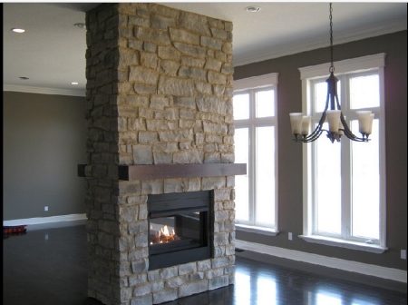 Here is a lovely fireplace done by Reece Masonry. Click  here  to see more samples of their work. 