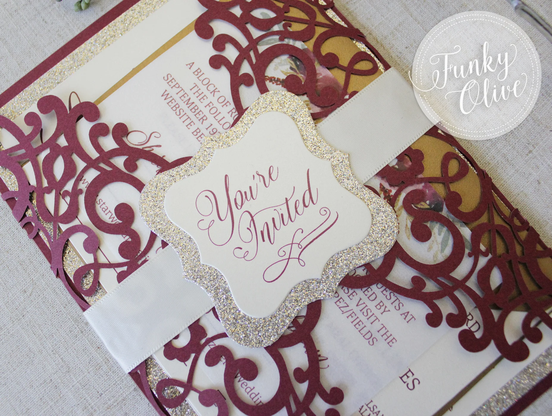 Another example of a satin ribbon band - shown in ivory, with a flourish die cut topper, layered on a gold leaf glitter backing layer.