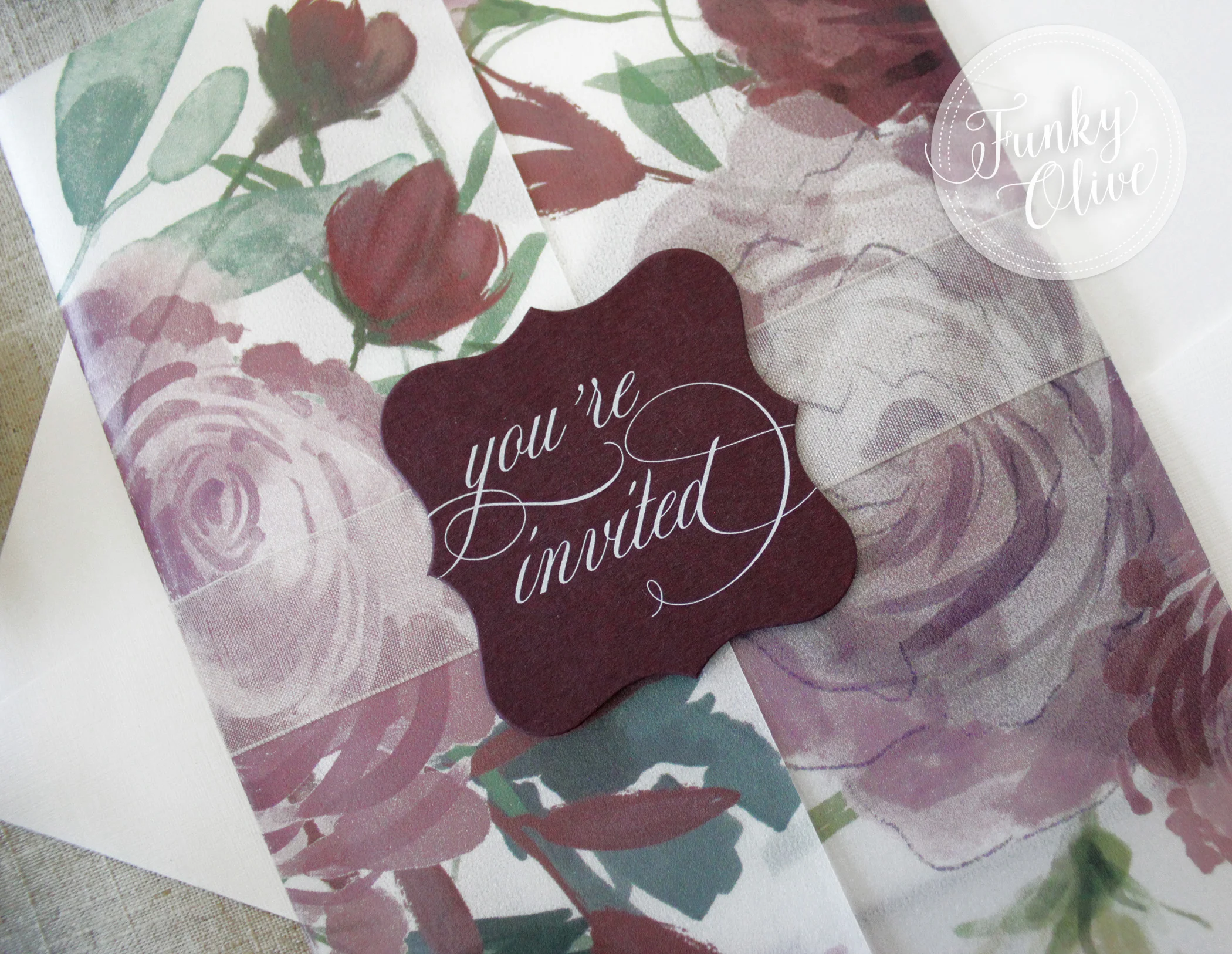An Ivory sheer organza ribbon is the perfect pairing with this matte burgundy die cut topper and drool worthy white ink printing. 