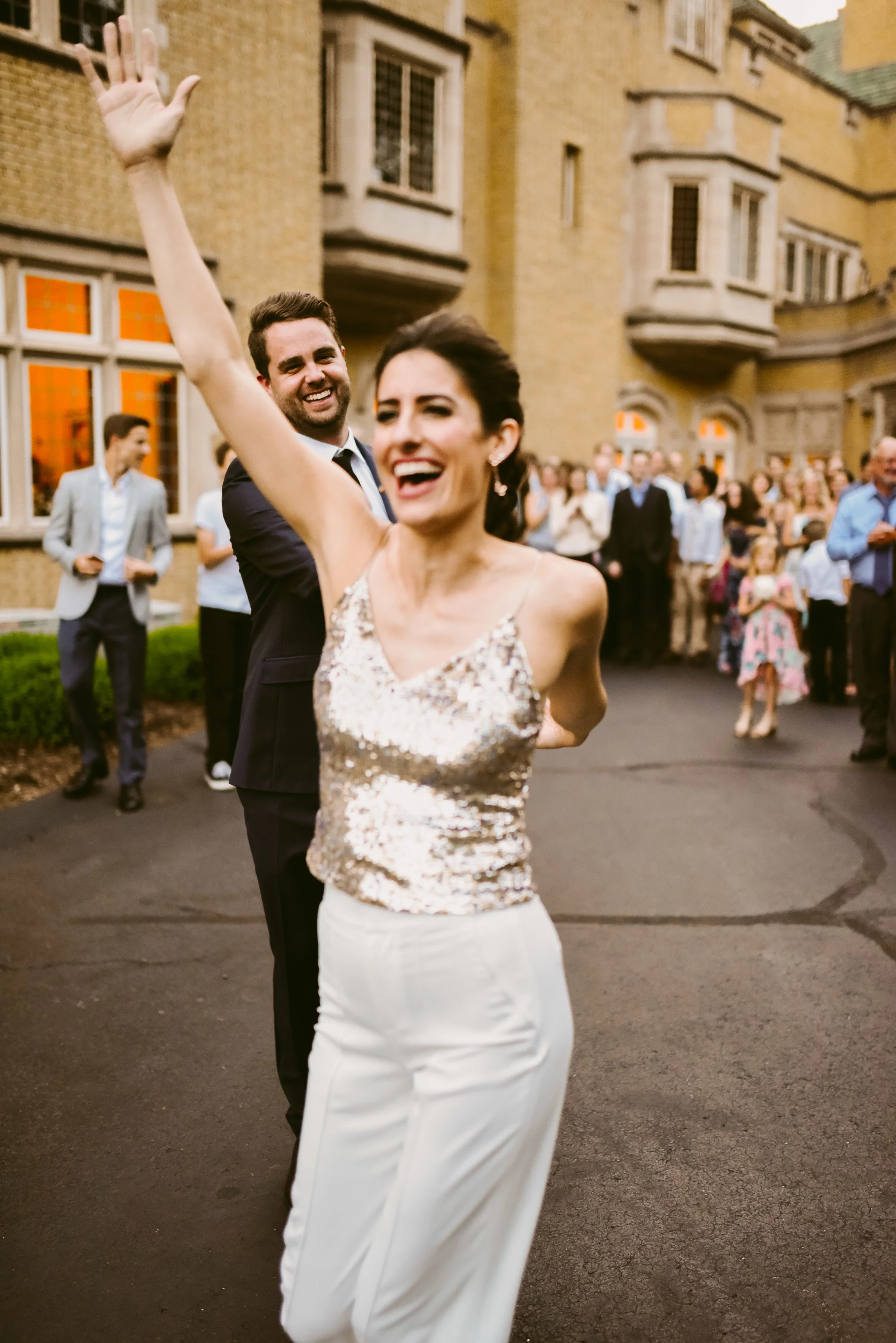 Dancing into their new lives like Heck Yes!!!! Also, can we talk about this outfit change? A super chic pant and sequin tank top? This bride is goals!!!!