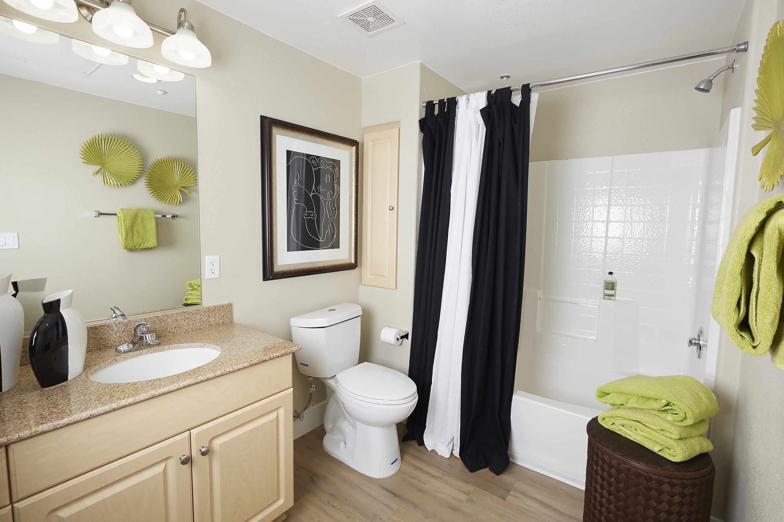  Our spacious bathroom with a large mirror and triple lighting. 