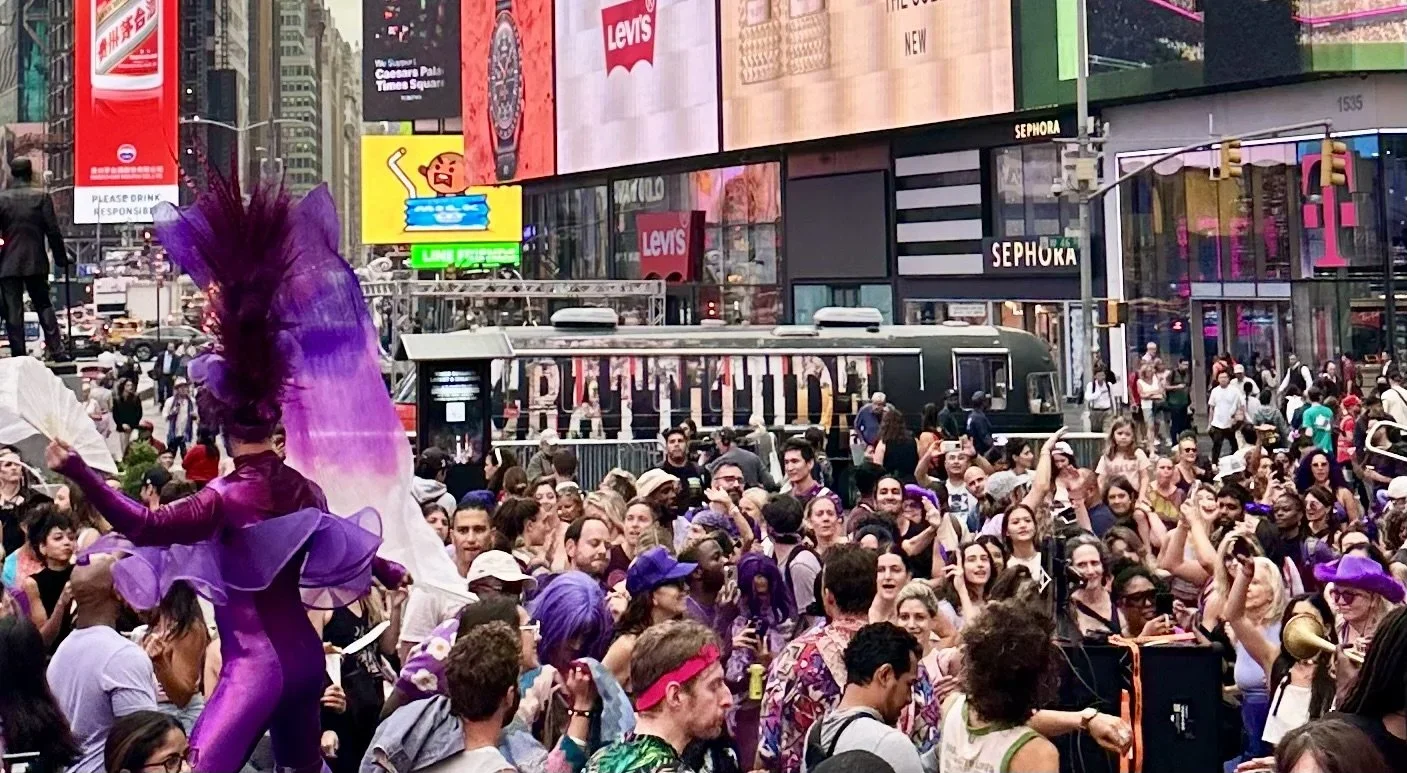 The Gratitude Bus in Times Square, surrounded by dance party. 
