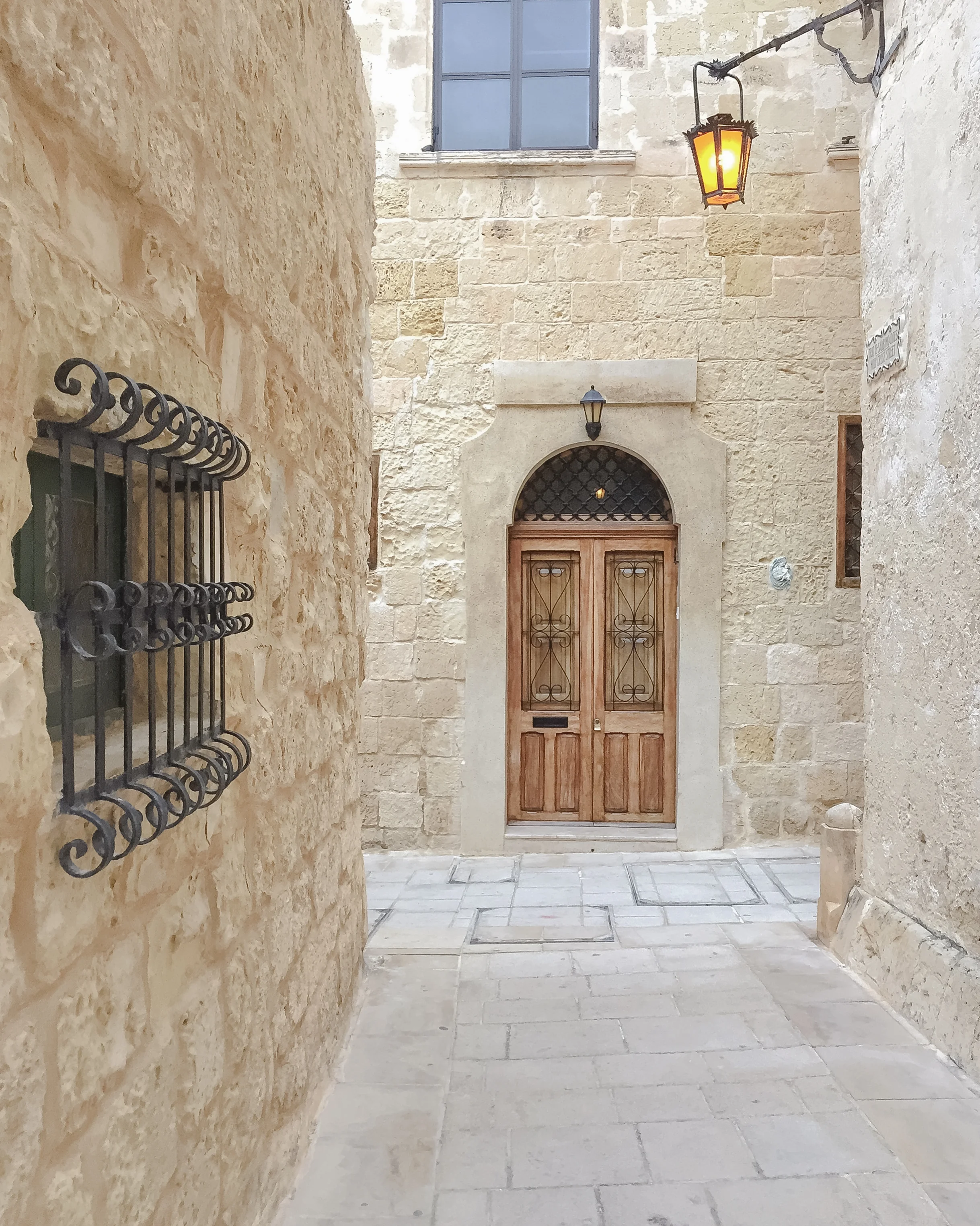 Maltese Door | Window | Street Light | Streets of Malta | Mdina | - Thinking About Appreciation For Quality In Malta | Malta, Europe | DoLessGetMoreDone.com | - Minimal Travel Documentary Photography - search for Liveability | Sustainability
