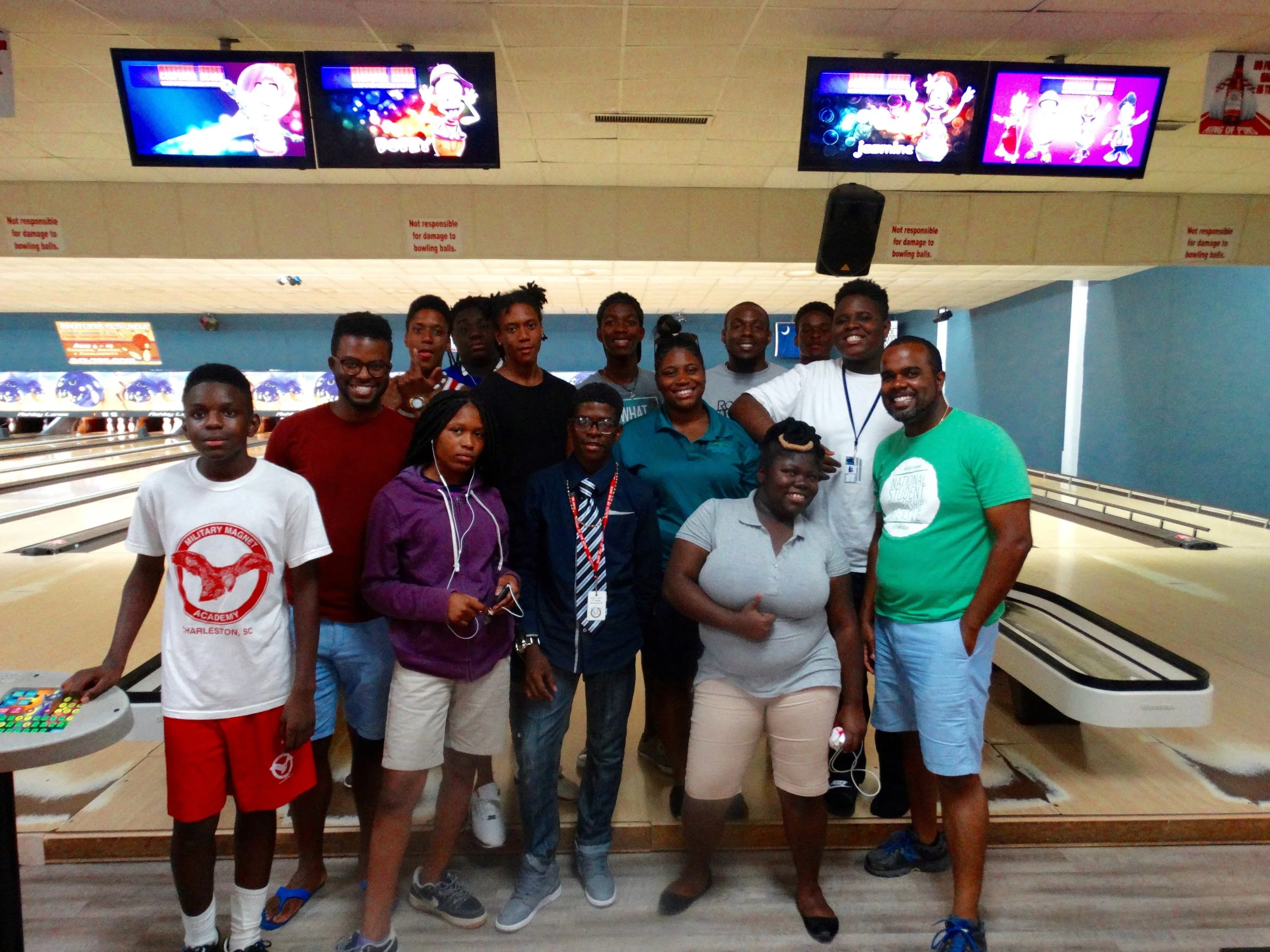 the young leaders of urban hope & metanoia building together during a game of bowling